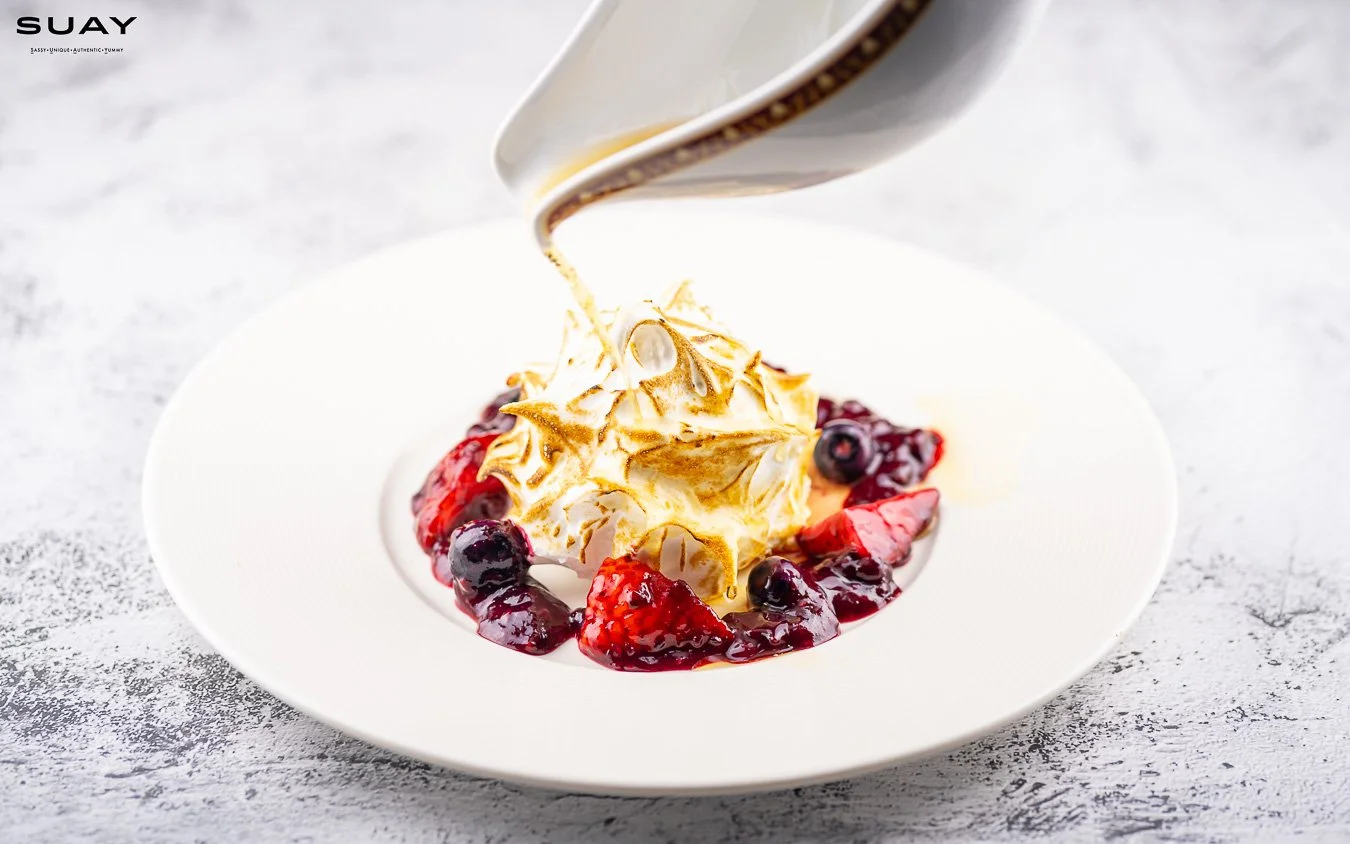 "Bomb Alaska" at your table flamed Bailey's ice cream sandwich & berries compote.