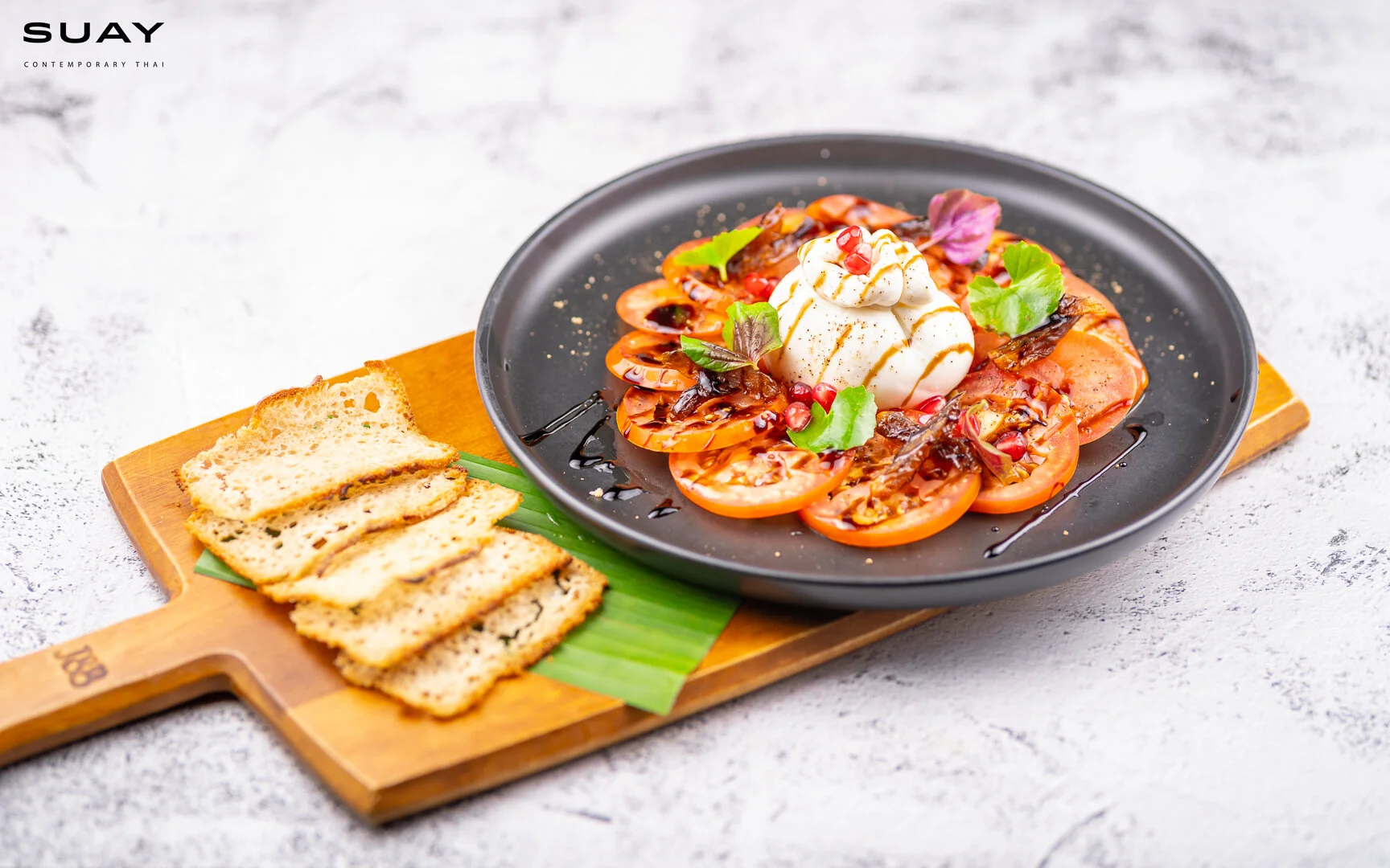 Hun Hin Burrata served with preserved Taling Pling fruit and homemade sourdough chips.