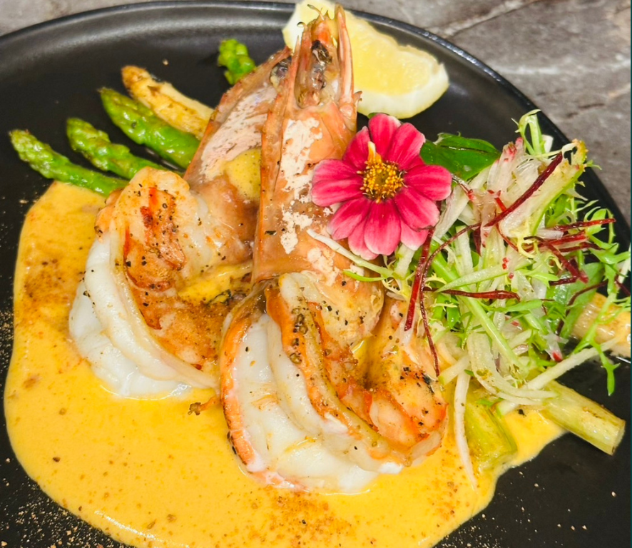 Grilled Andaman King prawns with White and Green Asparagus on Curry sabayon sauce