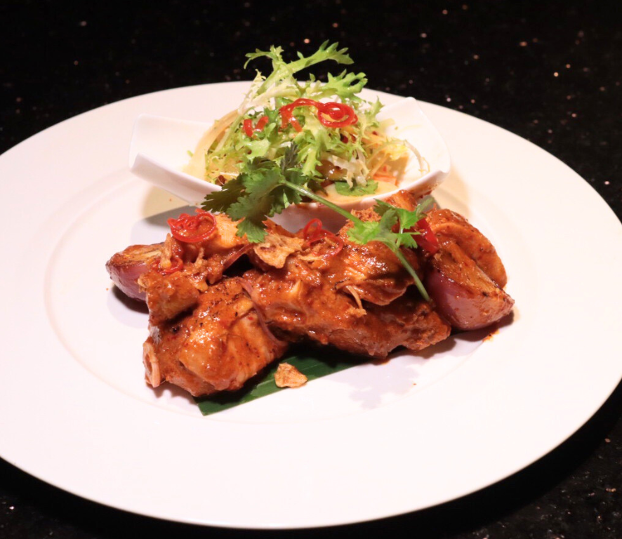 Grilled sous vibe chicken marinated with thai curry served with white turmaric acar