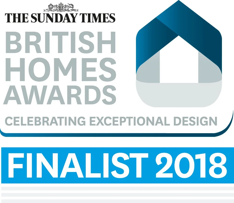 Logo for The Sunday Times British Homes Awards, celebrating exceptional design, with a blue and gray graphic of a house and text indicating finalist status in 2018.
