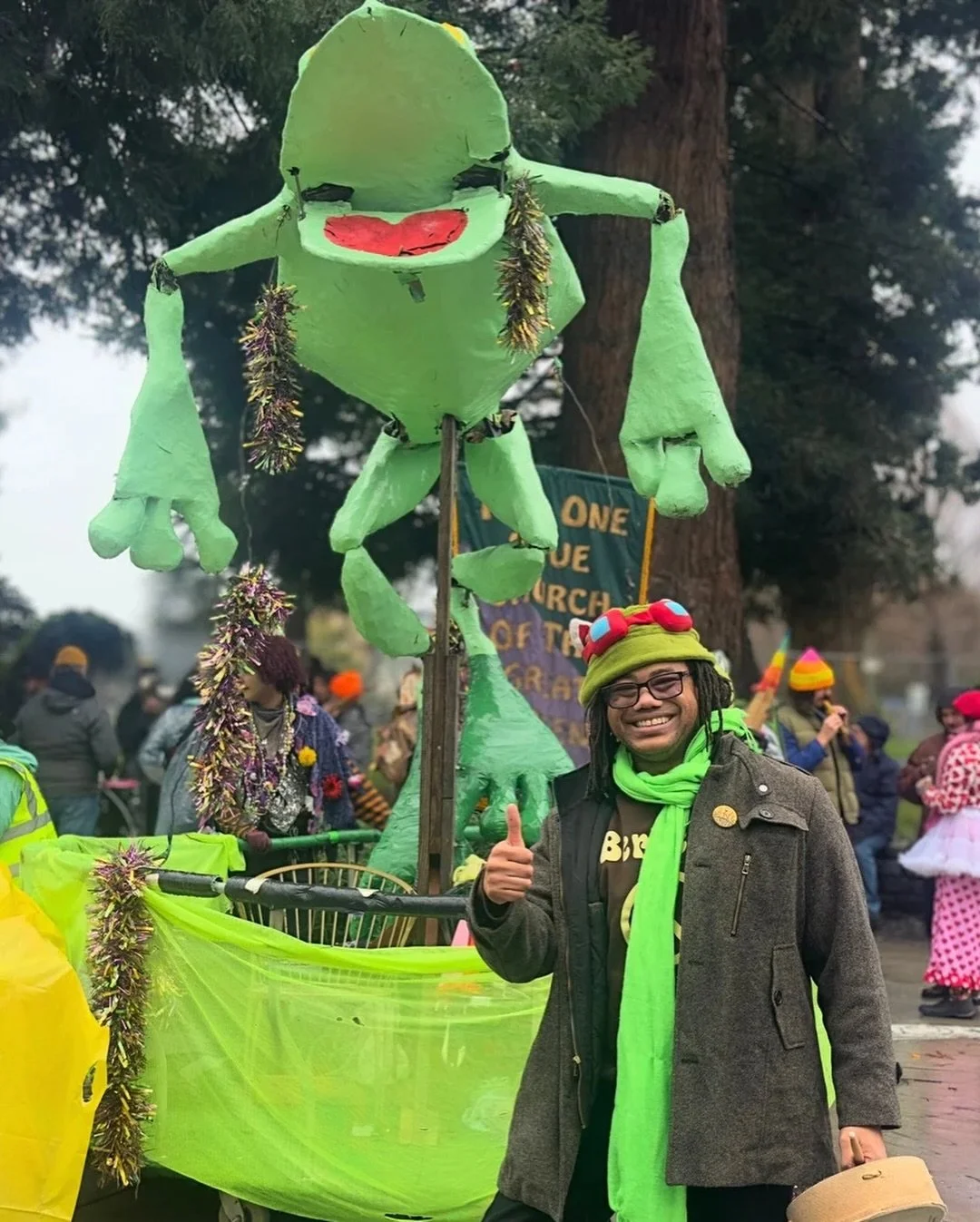 36th annual Berkeley Mardi Gras 🐸

Rain. Brass. Neon green frog overhead.

I joined the Telegraph contingent and walked with friends through the wet streets, laughing the whole way.

Humans need celebration. Joy is communal.

Taking the streets isn&