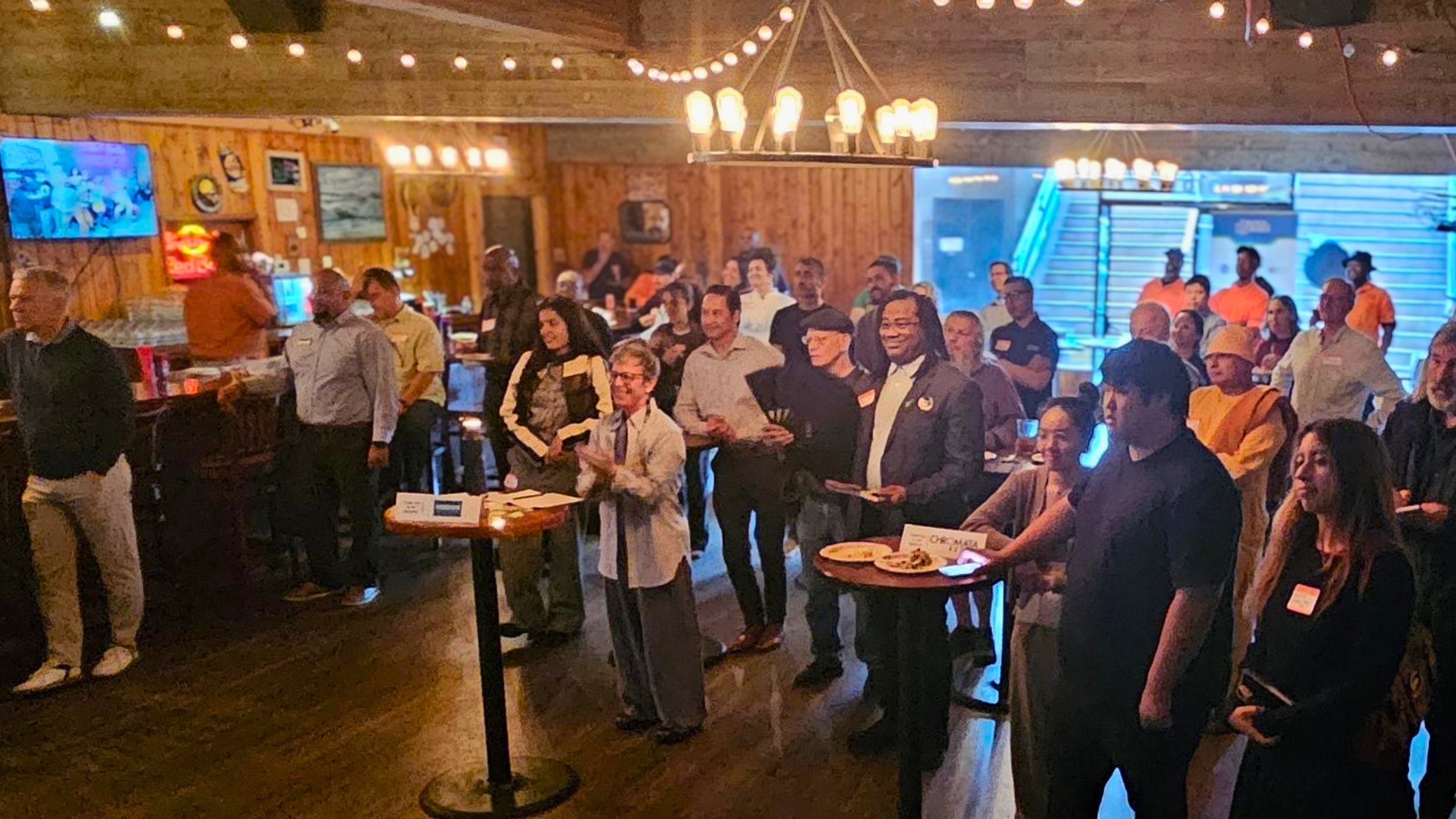 Community members, merchants, and Telegraph Ambassadors gather at The Tap Haus during the Telegraph BID annual meeting.