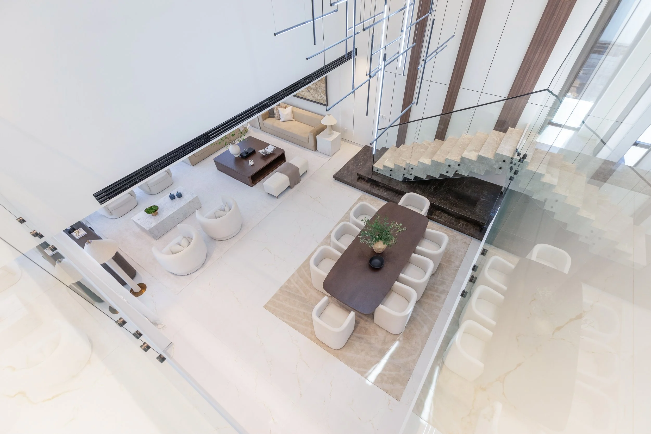 aerial view of a big, open living and dining room photographed by dubai interior photographer