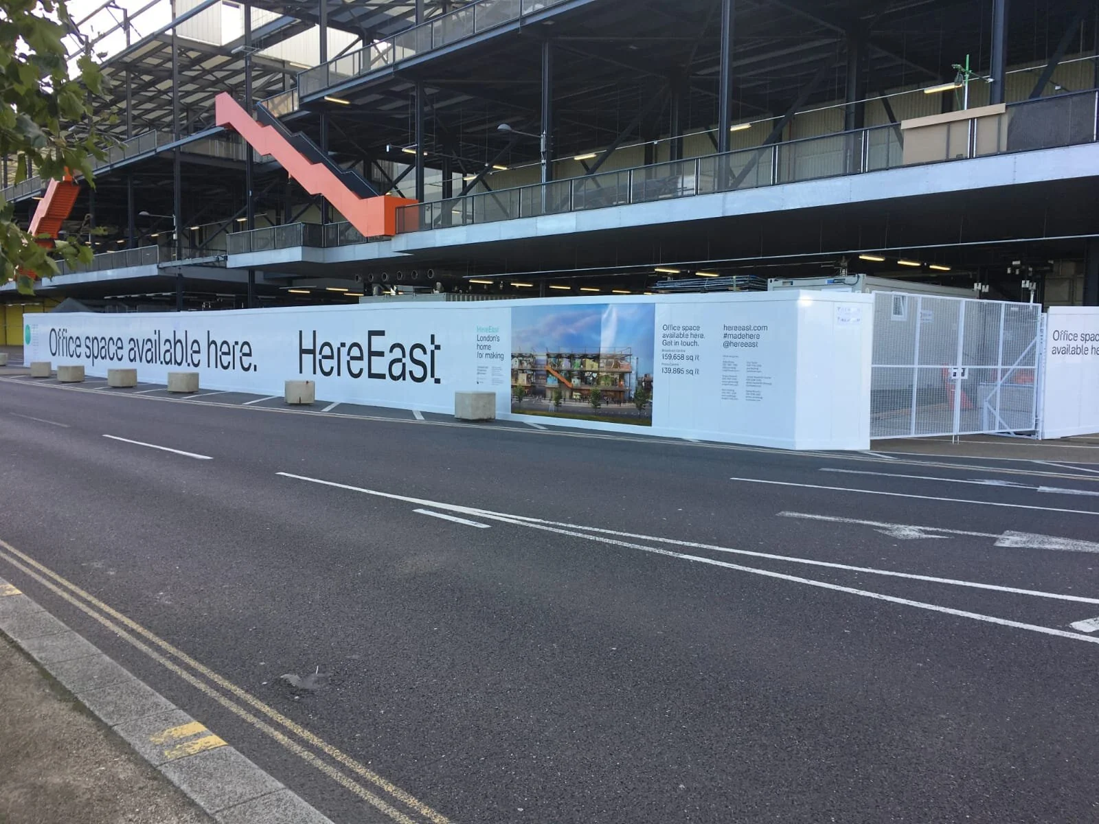 HereEast white hoarding 