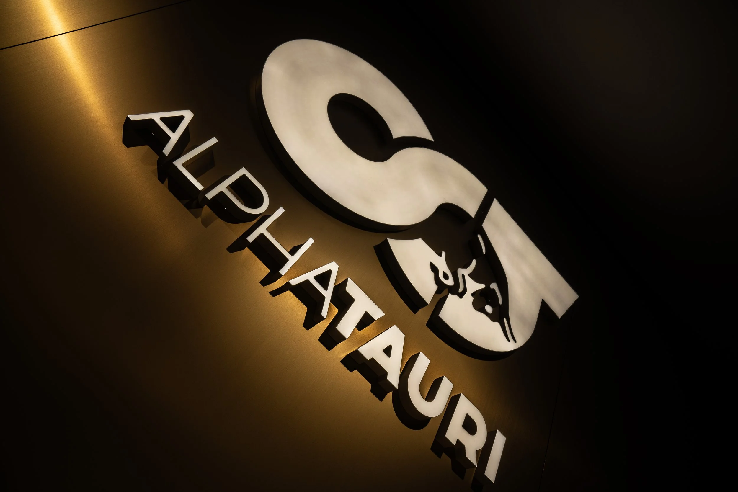 Alpha Tauri F1 team store in Knightsbridge.  Multiple signage solutions including Acrylic, Perspex, Halo Illumination, Laser Cut Steel and more