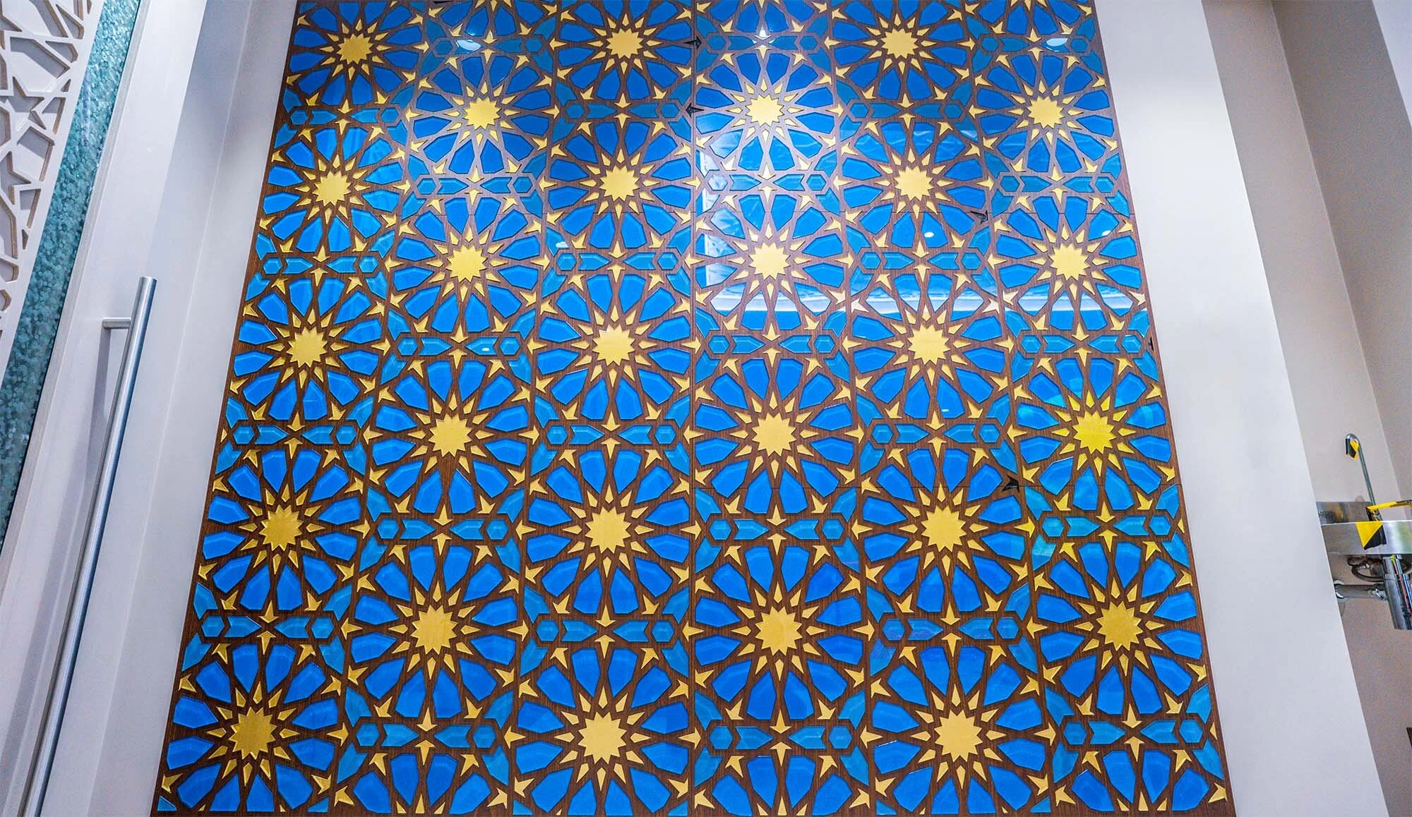 Blue and yellow custom mosaic wall installation