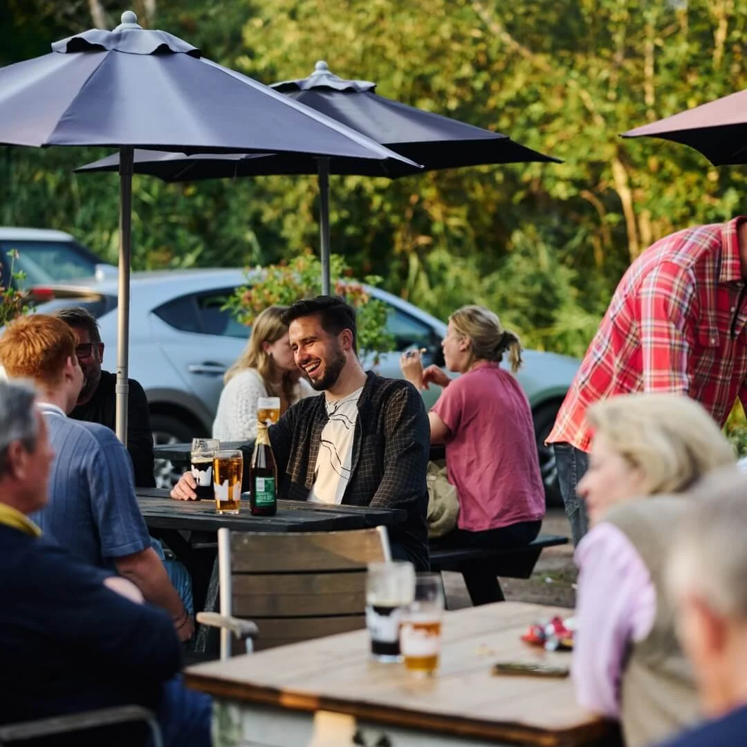 Customers enjoying drinks at an independent brewery taproom
