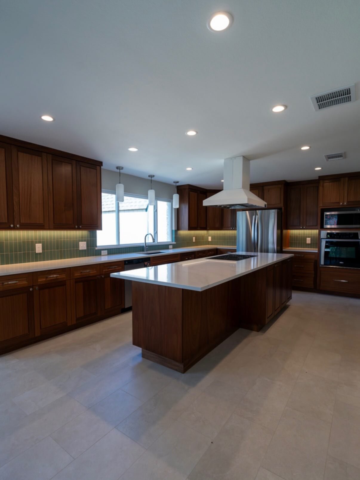 Problem: Transforming a cramped outdated layout into a modern space without losing its old school charm? 

Solution: Blend retro wood aesthetic with warm tones and contemporary touches. 

The result? A nostalgic yet fresh kitchen that stands the test
