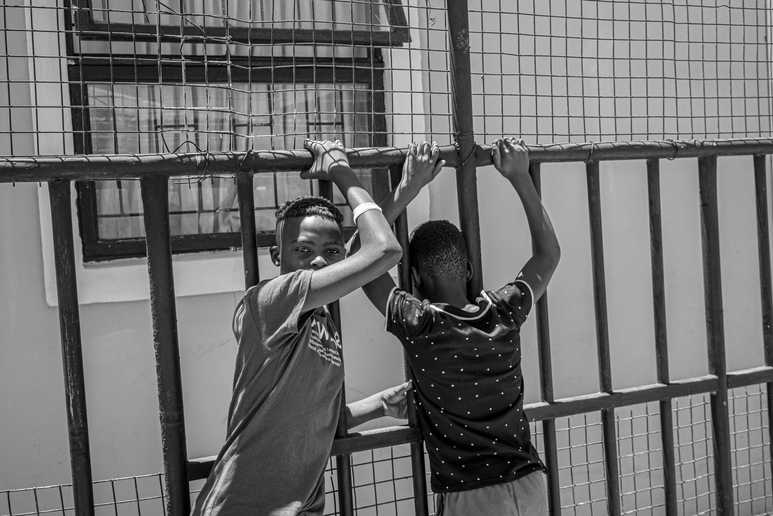 Dunoon, Cape Town, South Africa - 04/01/2019 Young boys hanging in the township of Dunoon. Being part of the so-called ‘born-free generation, they were born after the abolishment of the Apartheid regime. Although this came with much promise for equ