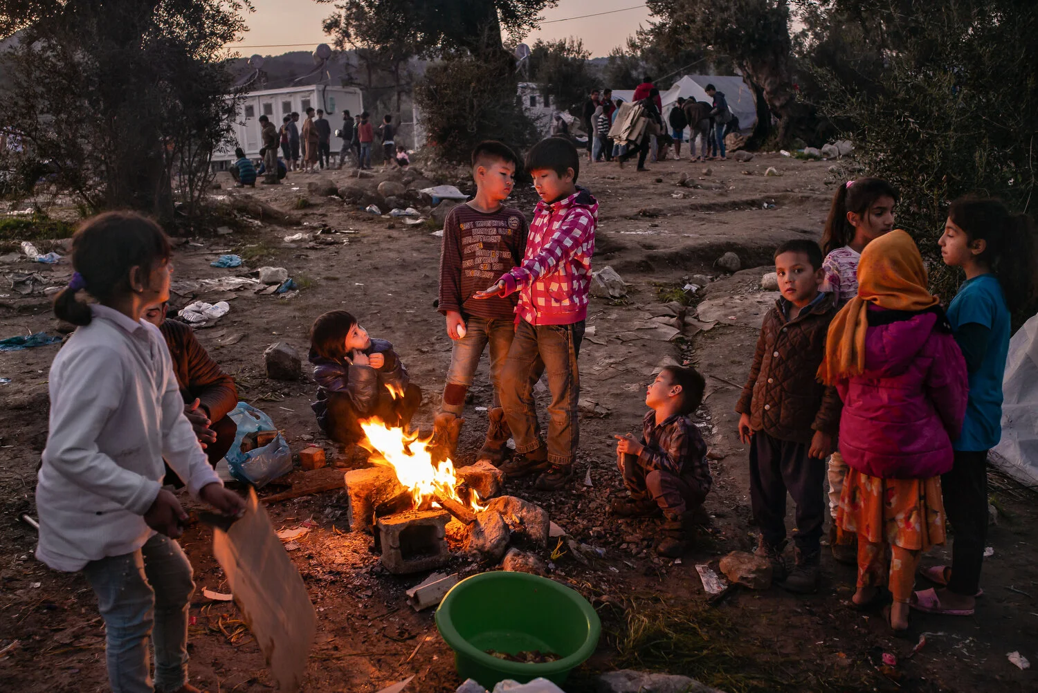  Moria Camp, Lesbos - 27/11/2019  Children warming by a fire in the winter of 2019. Average temperatures drop to 5℃ at night during the winter. On some nights, the temperature drops below zero. 