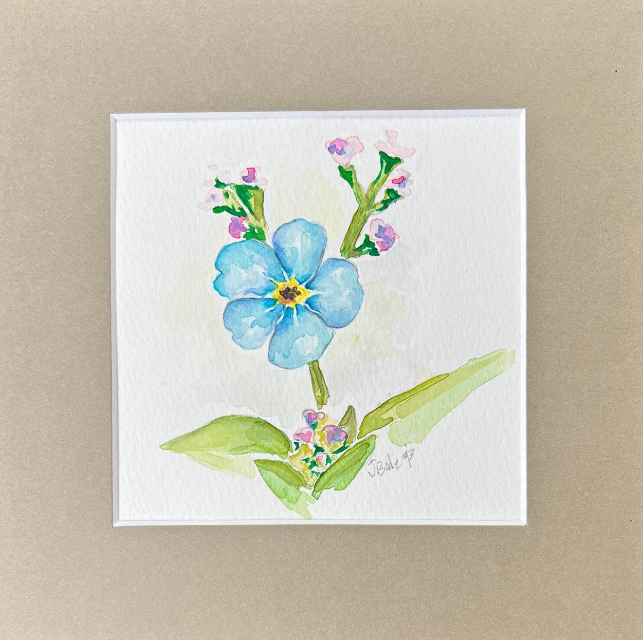 8x8 umber color mat surrounding the beautiful blue watercolor of a forget-me-not flower.