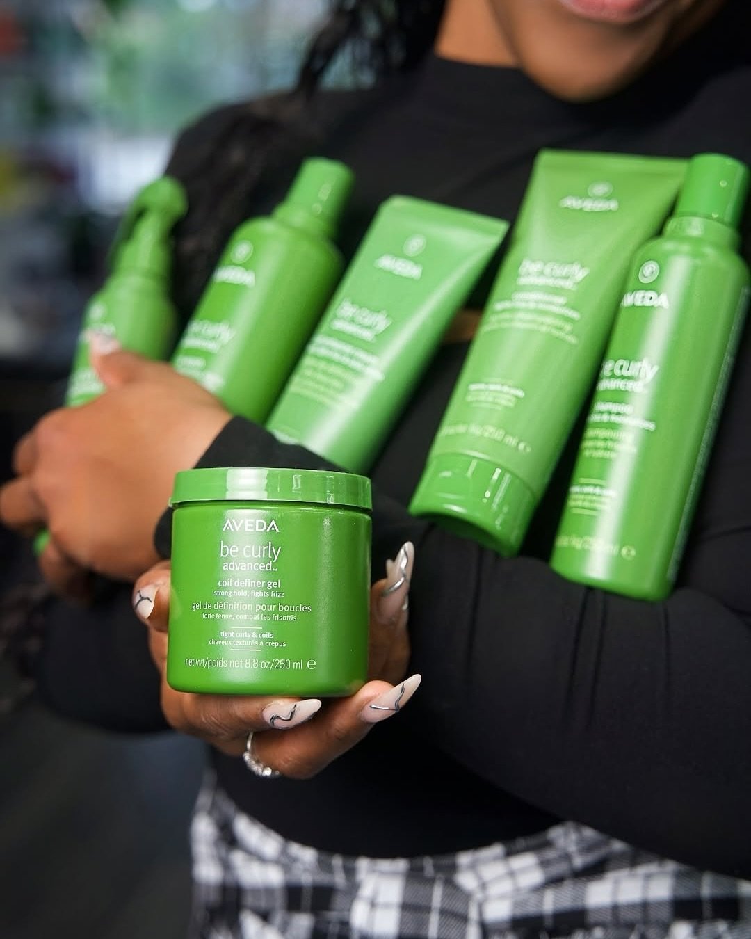 Why settle for one when your curls deserve it all? 💚 @ashleymitchellsalonandspa 

The Aveda Be Curly Advanced&trade; collection is your summer go-to for hydrated, defined, frizz-fighting curls &mdash; from soft waves to tight coils. This full lineup