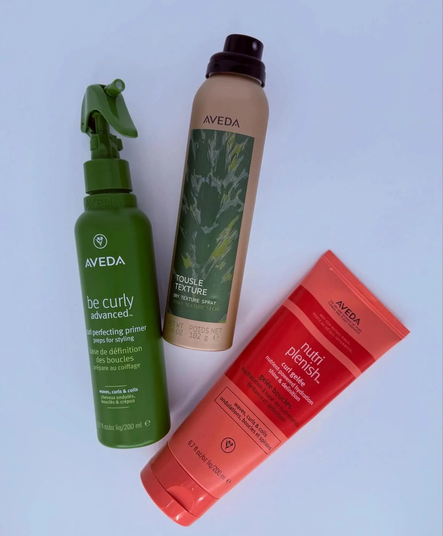 Big hair starts with the right foundation. ✨ @lindsey.phelps 

These three Aveda essentials are the secret to full, bouncy, touchable hair from root to ends:

🌿 Be Curly Advanced Curl Perfecting Primer
Preps and defines curls while protecting agains