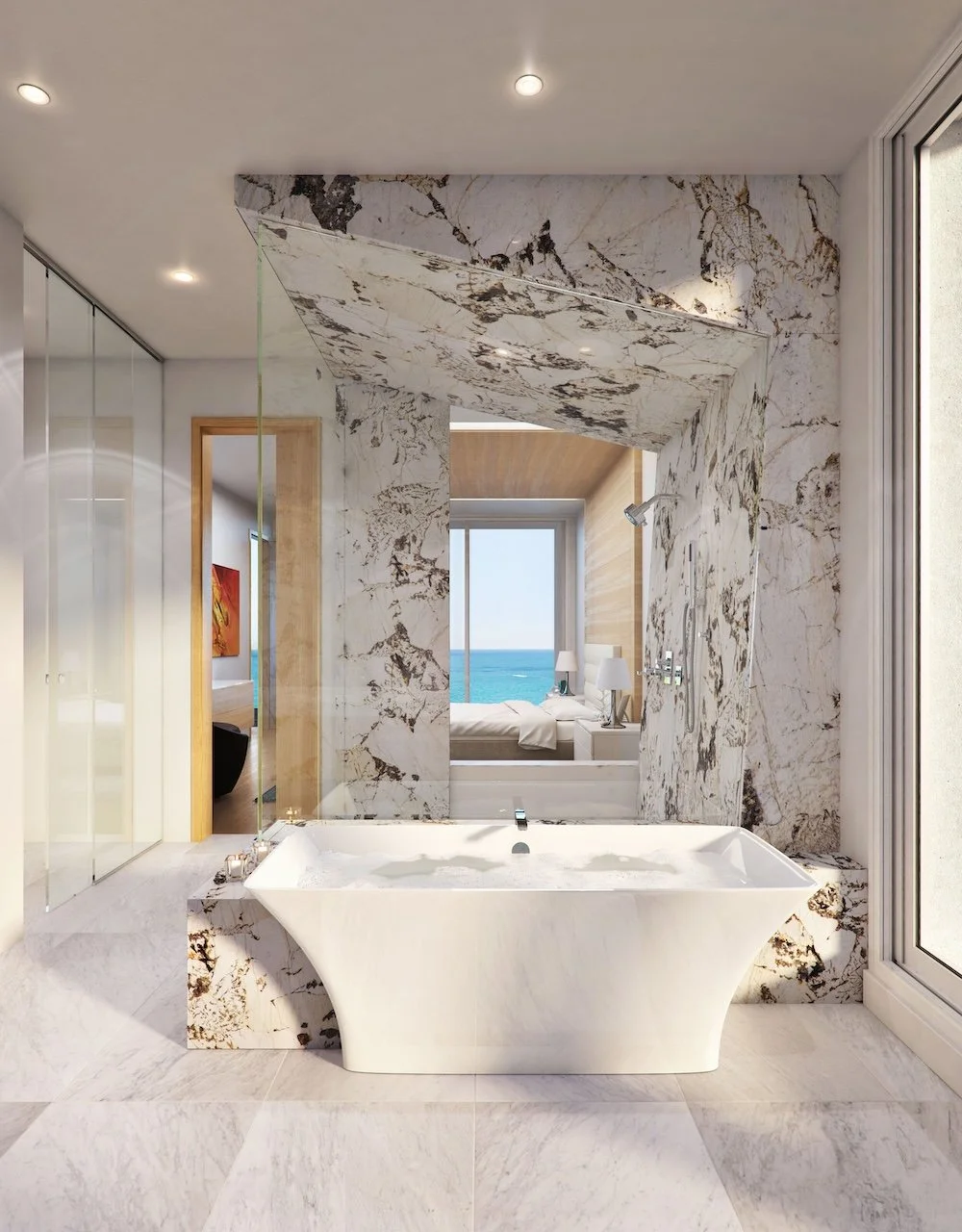 A modern bathroom featuring a stylish freestanding white bathtub with jets, surrounded by luxurious marble walls that blend white and gold tones. In the background, large windows reveal a scenic view of the ocean and a bedroom area with light-colored