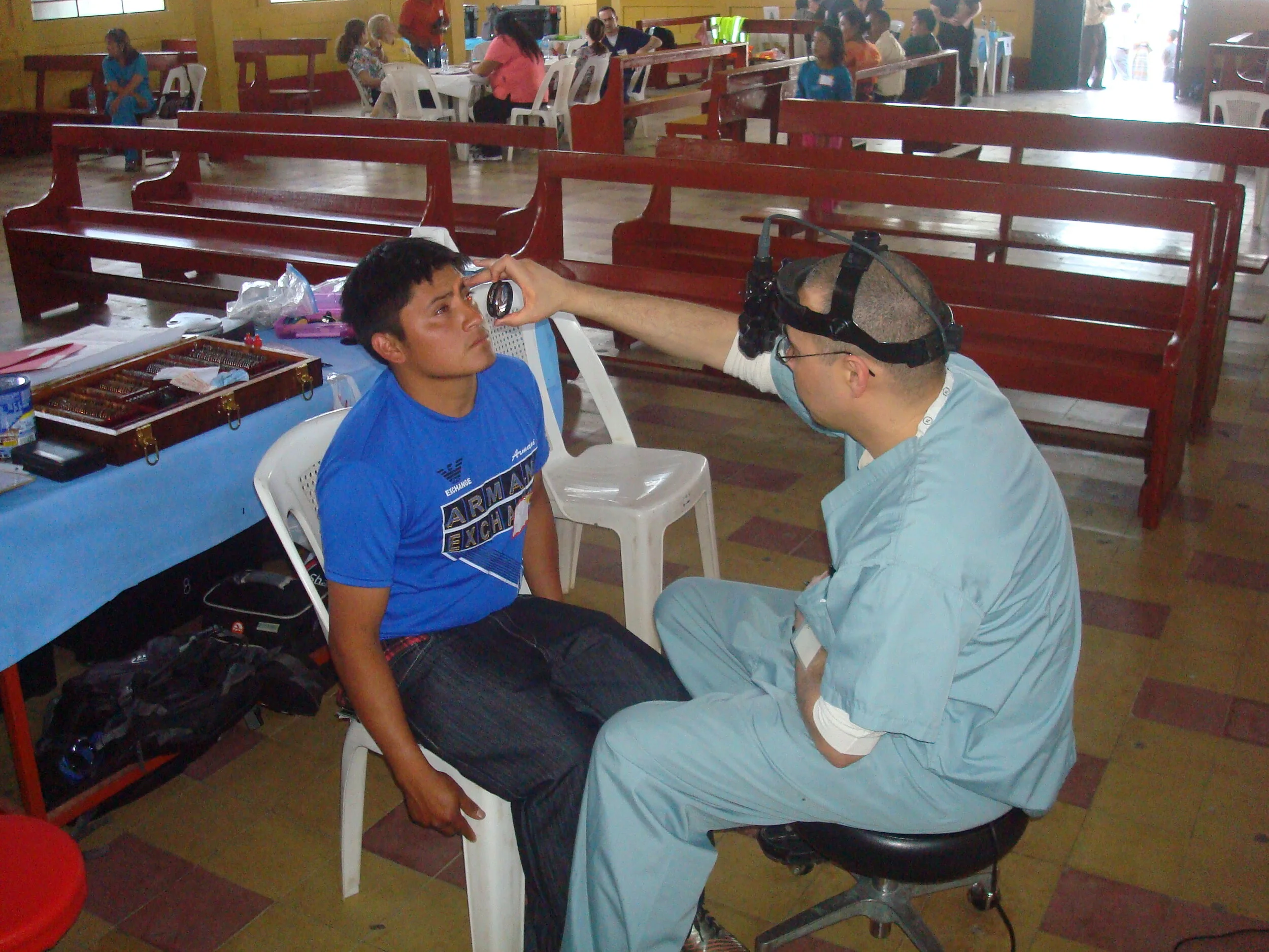 DSC06966 Dr. Ammo exams young boy.JPG