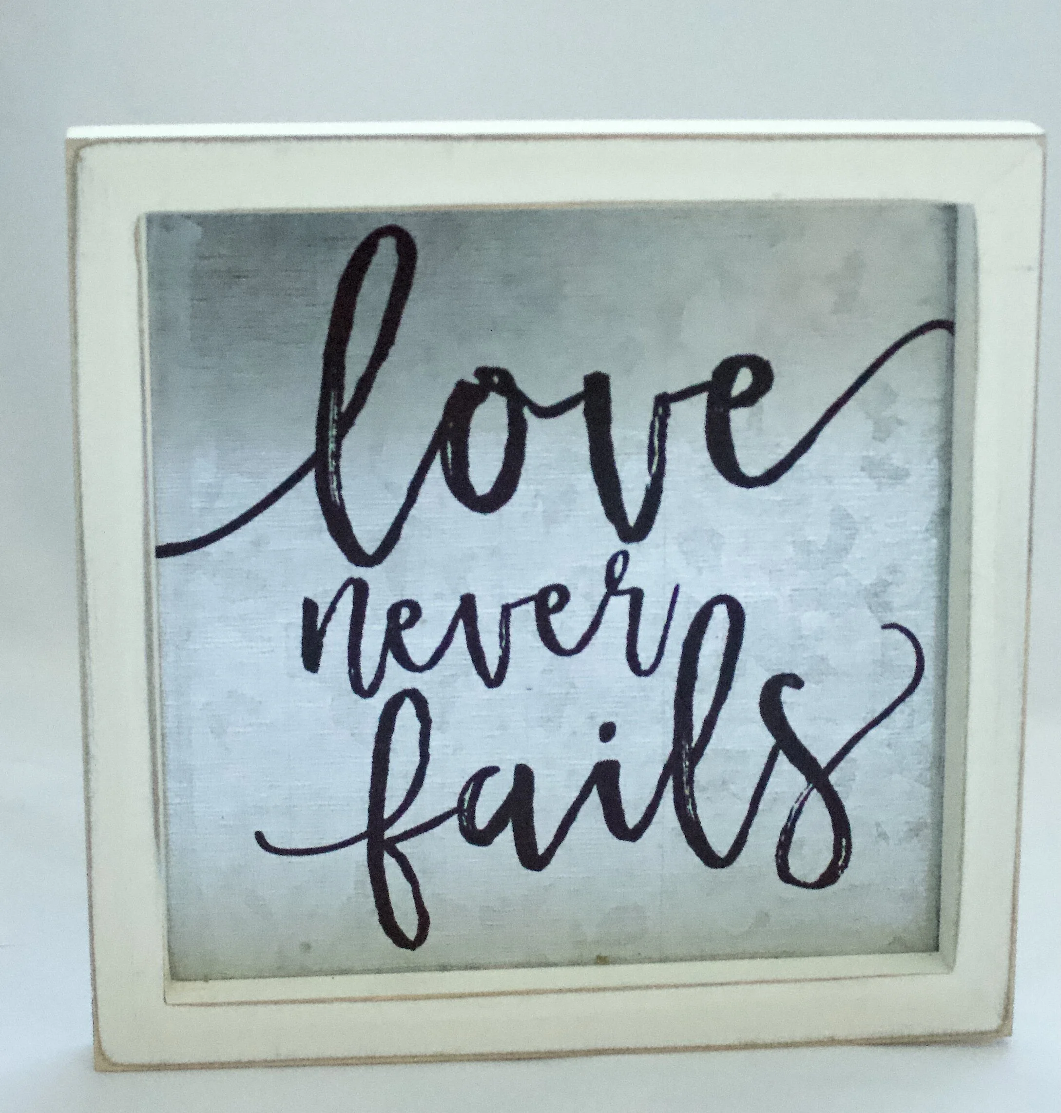Love Never Fails sign