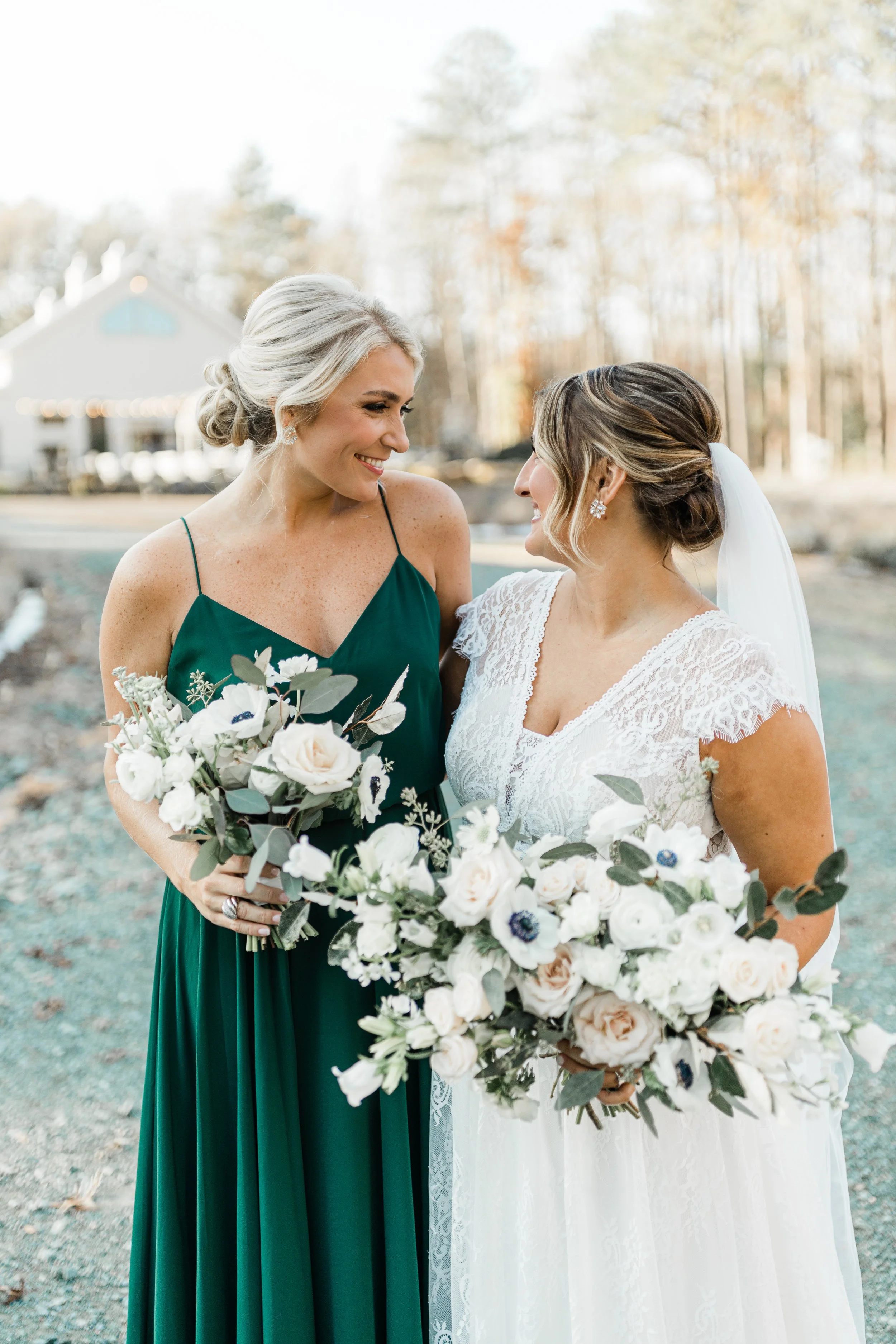High-definition bridal hair artistry featuring a textured upstyle and side-swept tendrils, styled for a bright and airy North Carolina wedding ceremony.