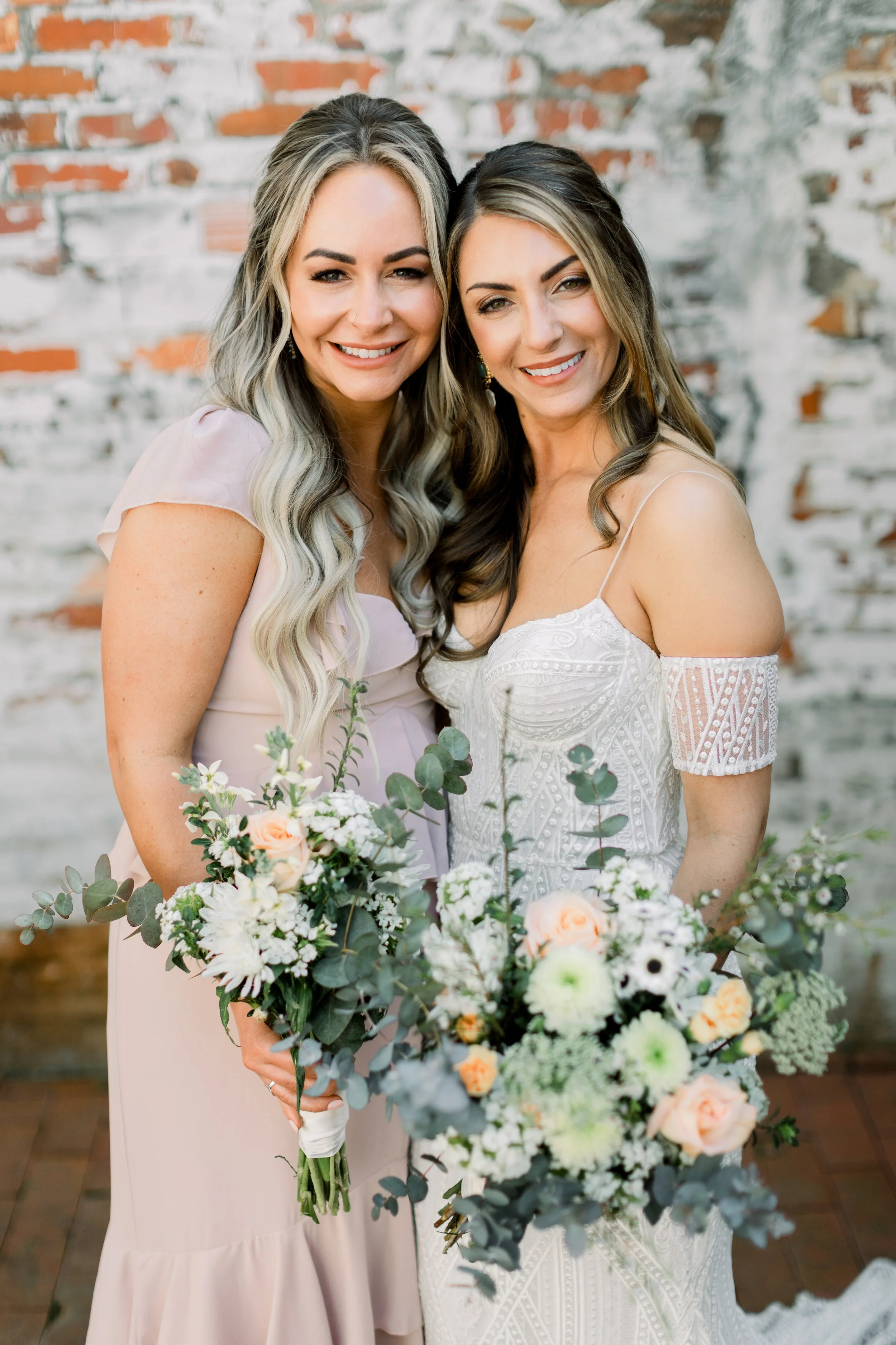 modern half-up bride with bridesmaid in Cary, NC
