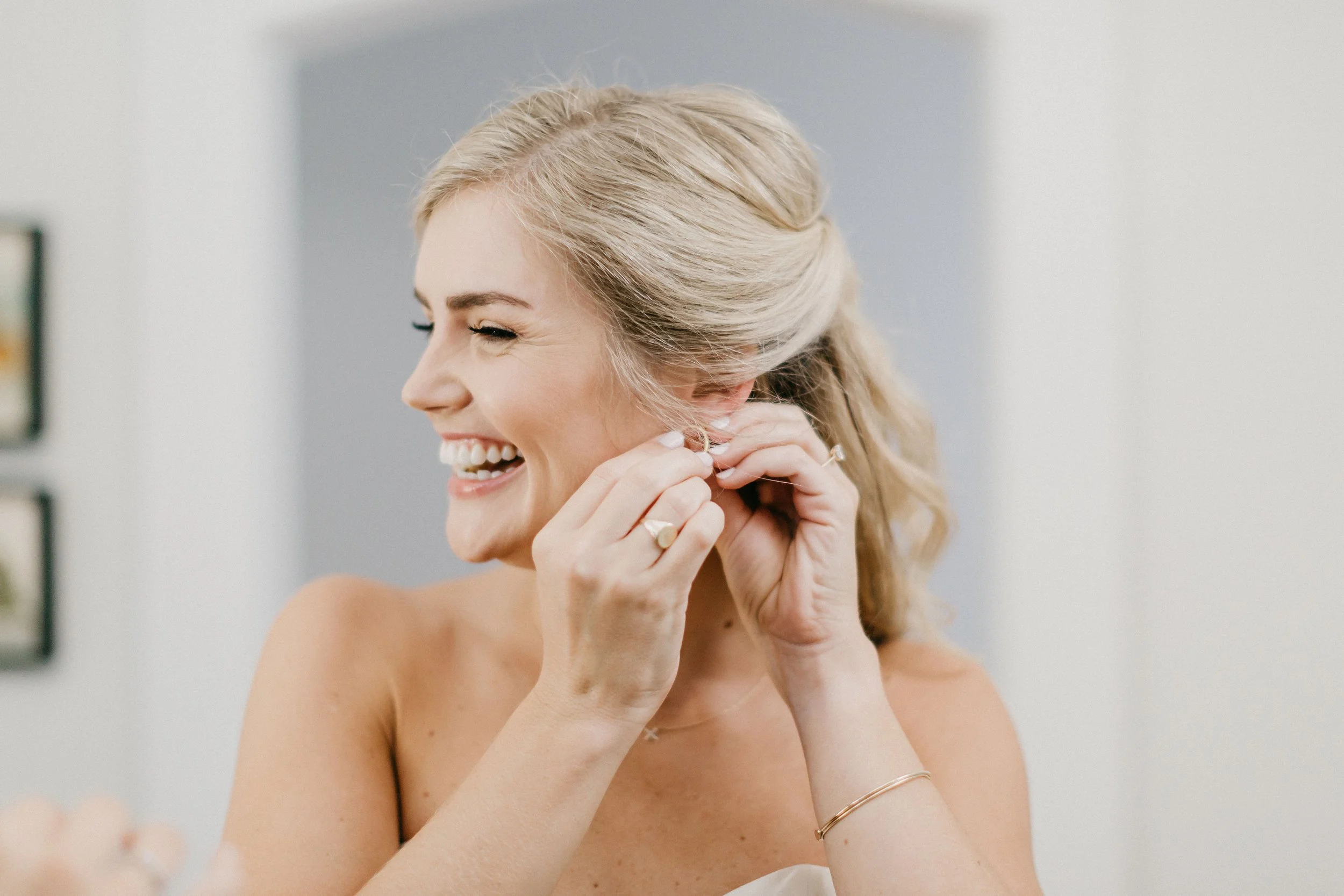 Refined bridal half-up silhouette with soft editorial texture and face-framing details, styled by a specialist in Raleigh, NC.