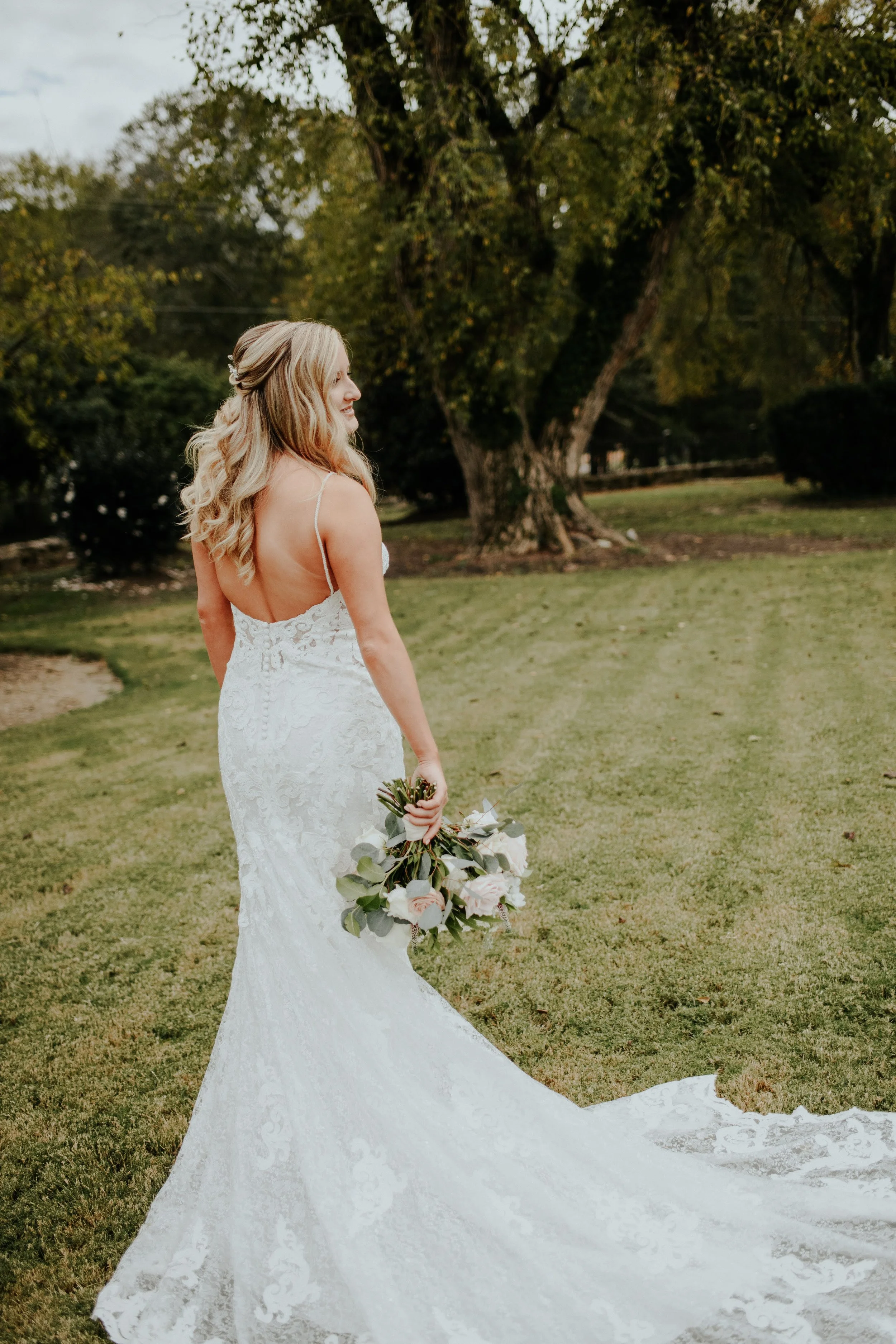 Luxury half-up half-down bridal hair styling for a bride in Angier, NC near Raleigh.