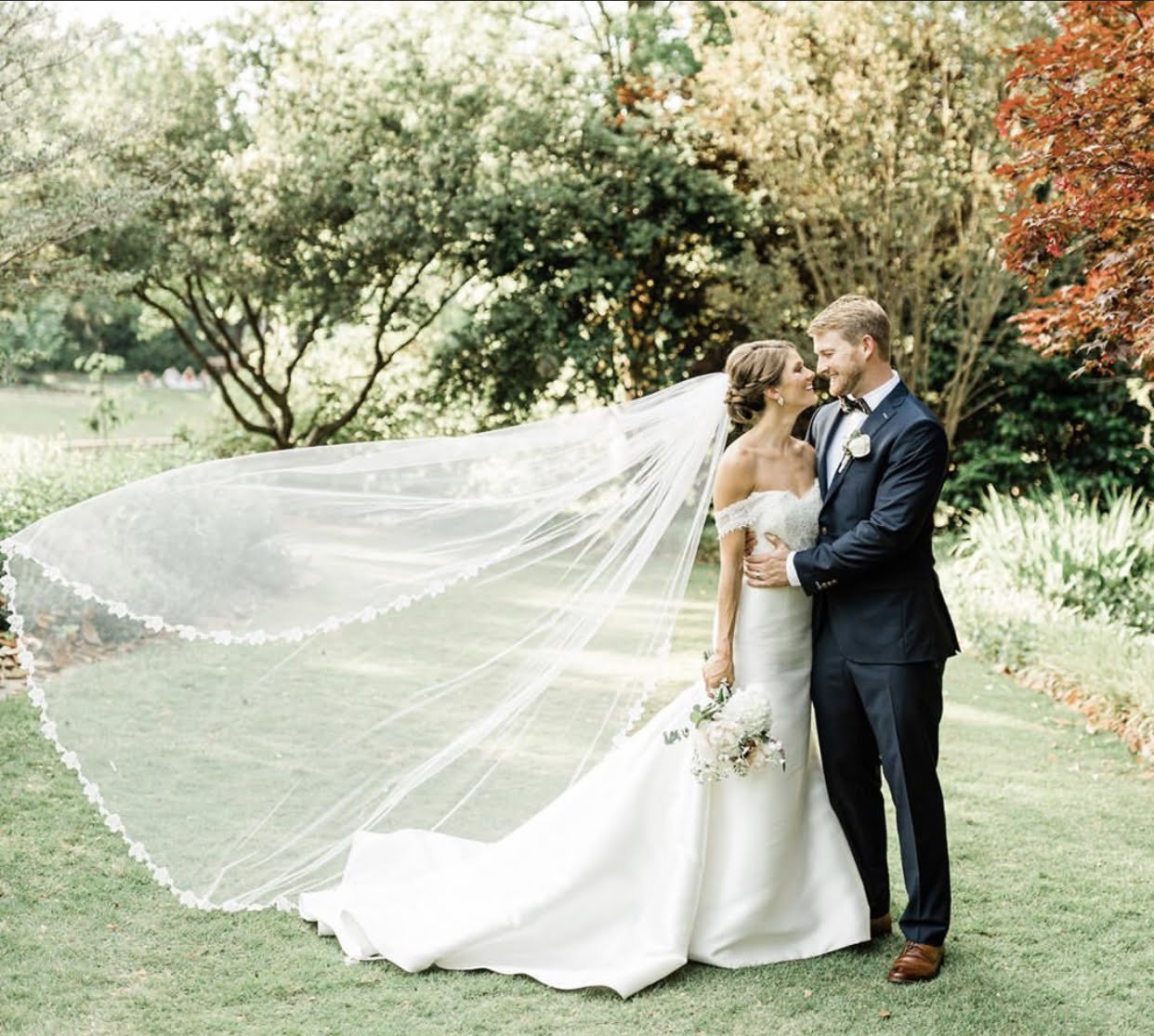 Classic and polished bridal upstyle with a sleek finish and traditional veil, showcasing a timeless bridal silhouette for a North Carolina estate wedding.