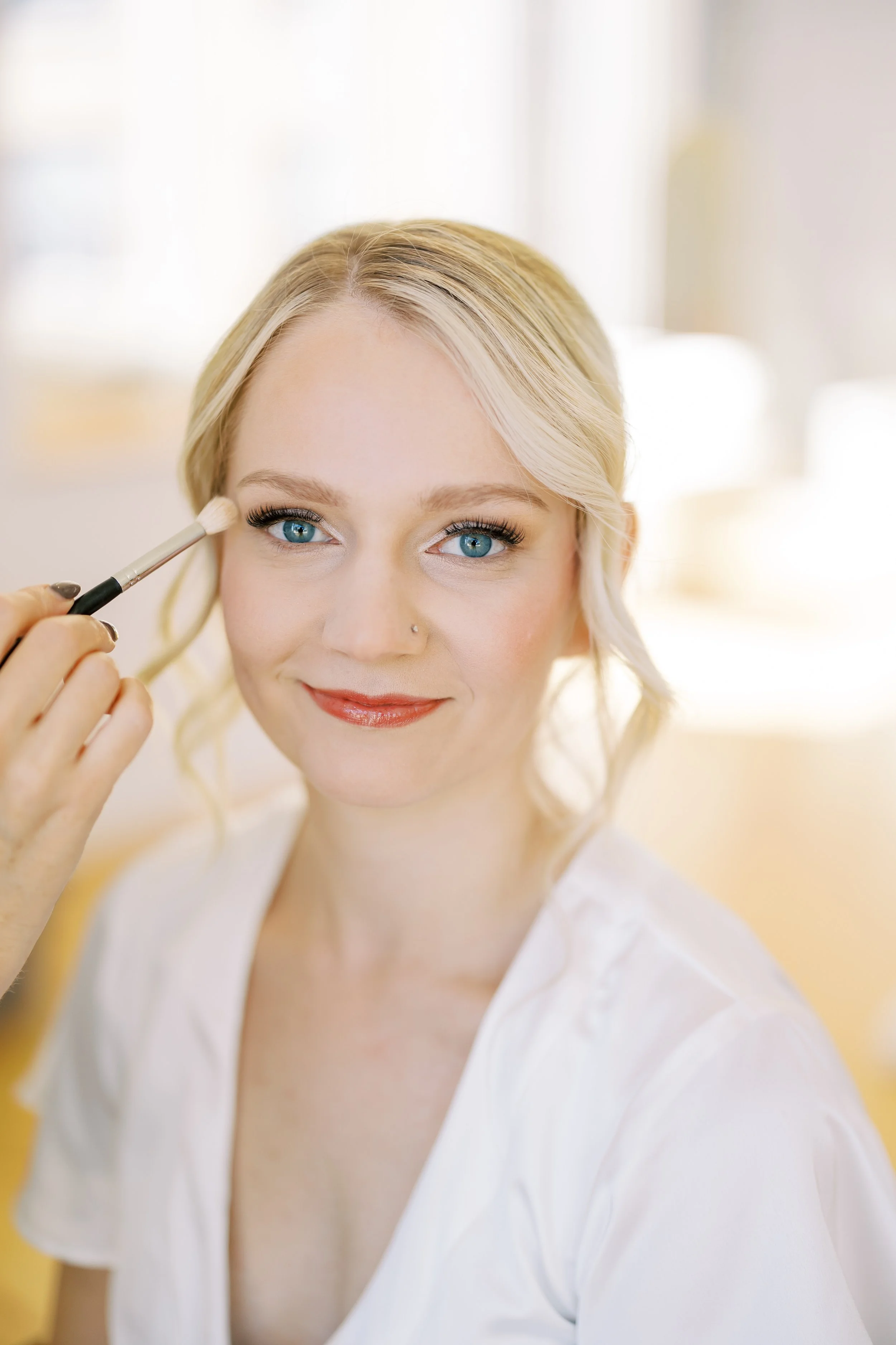 Luxury bridal makeup application for a bride in Raleigh, NC featuring soft glam eyes and a natural finish.