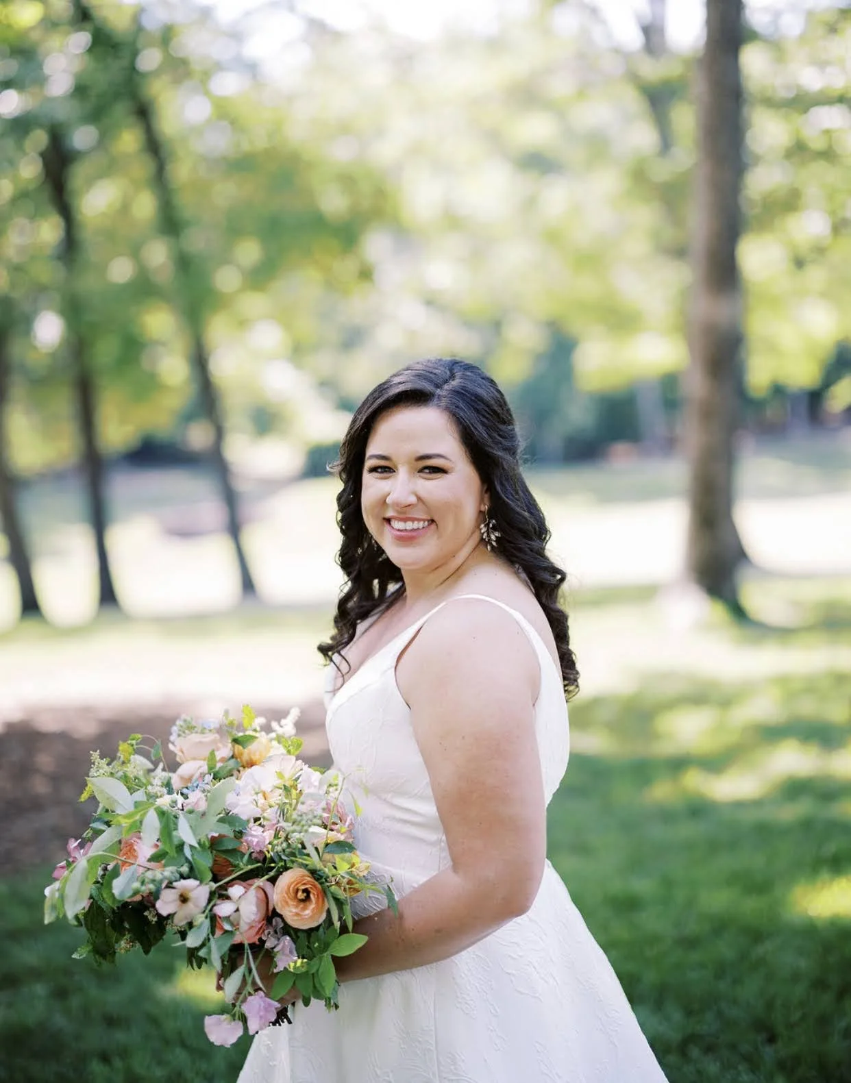 Sleek and modern clean-girl bridal half-up hairstyle with polished tension, designed for a contemporary luxury wedding in the North Carolina Triangle.