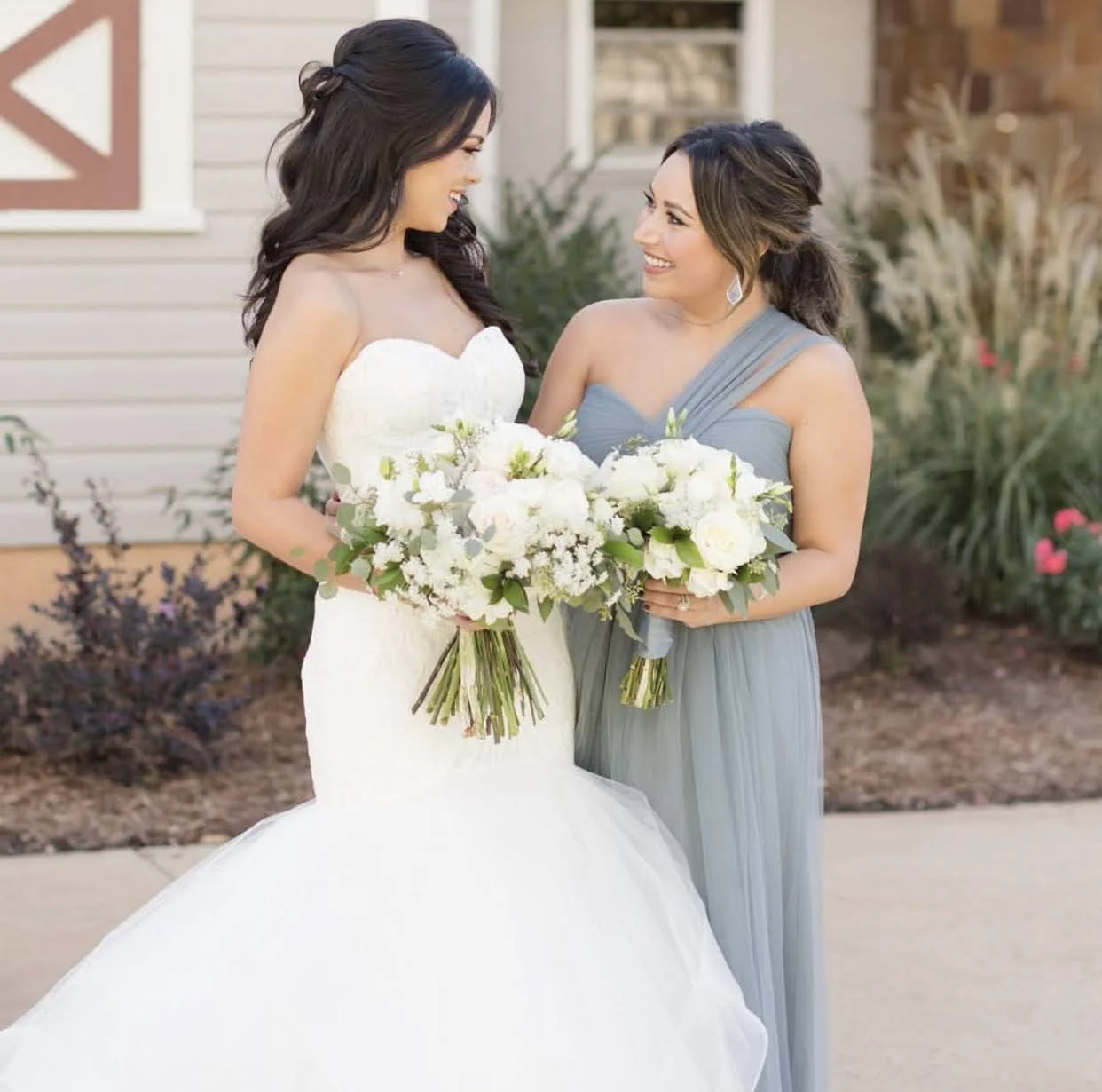 High-fashion bridal hair transition from a polished half-back style to a reception look, curated by a luxury North Carolina bridal hair artist.
