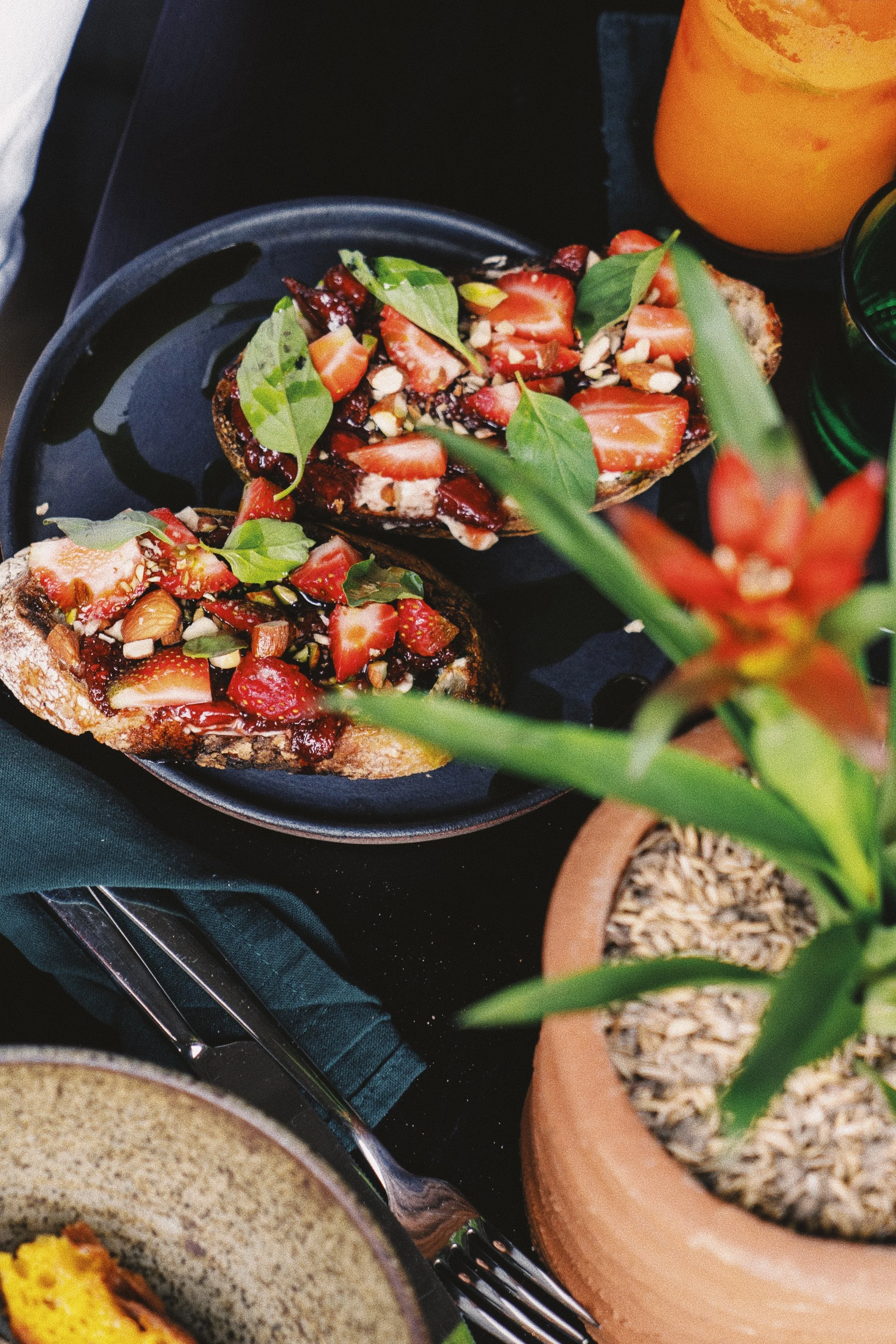 Breakfast table with seasonal dishes at The Hula in Pererenan, Bali.
