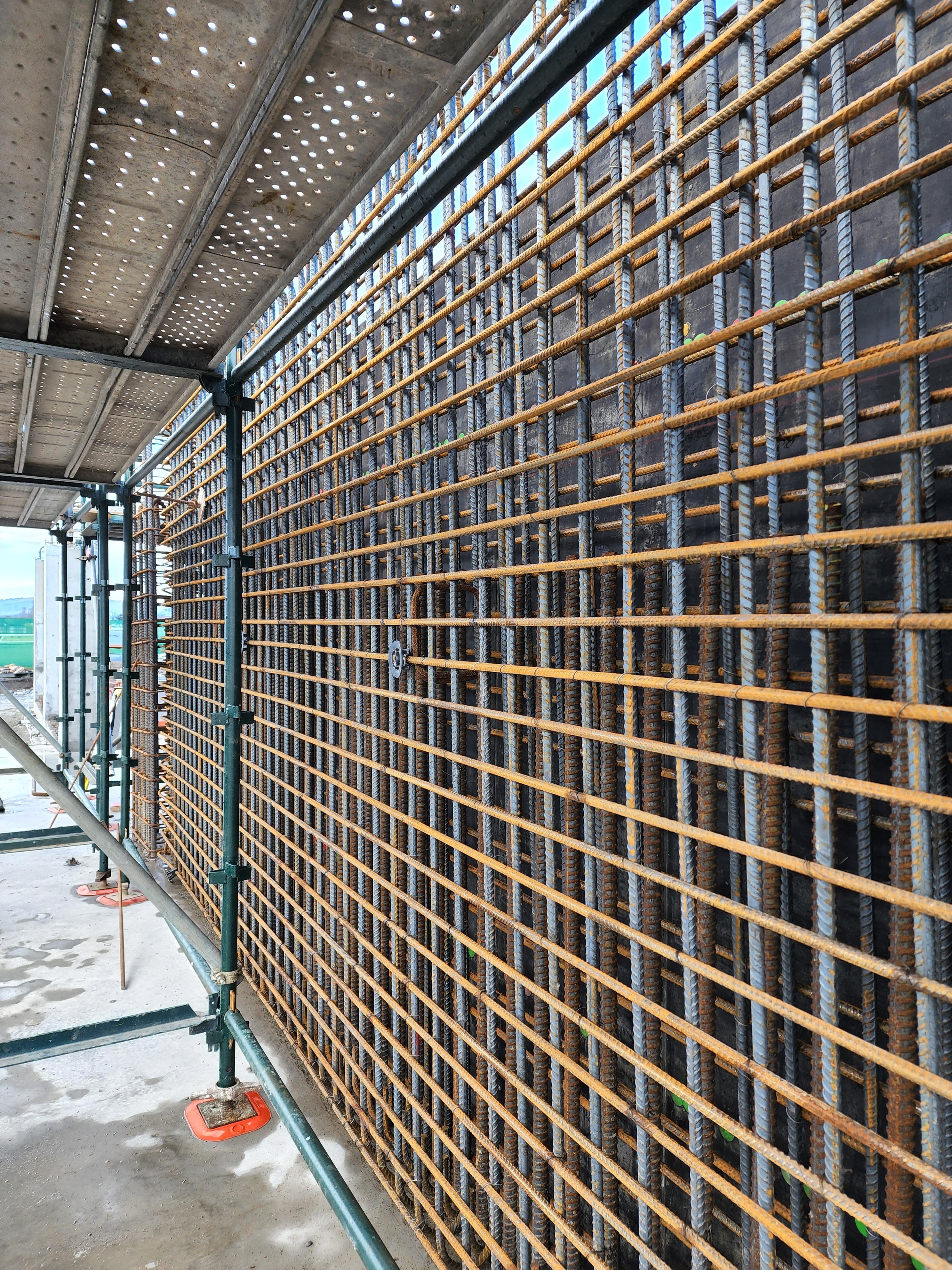 angled image of rebar steel wall
