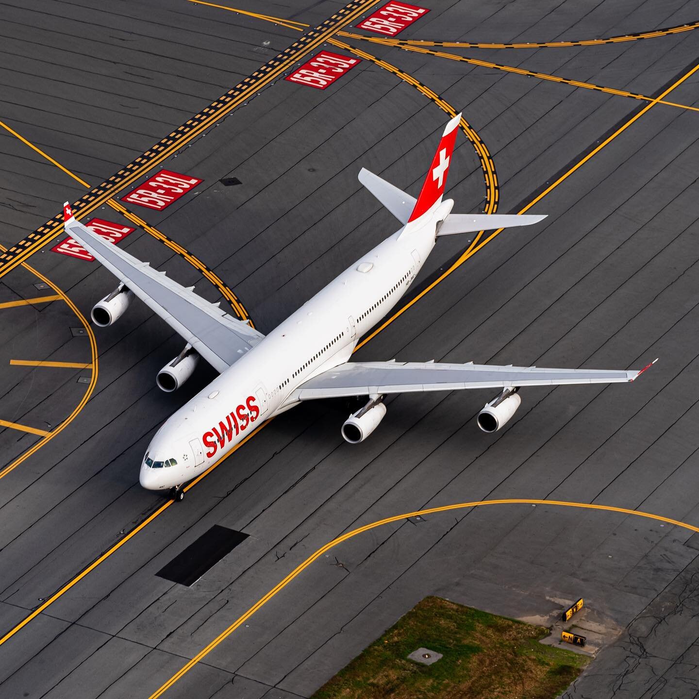 A favorite of many, the Airbus A343 looks elegant from any angle, particularly in the classy Swiss Livery in this aerial photo I took over BOS in 2020. 
&bull;
I am very proud to have Ethan (@boston_planespotter.ejl) by my Edit Collaborator on my pho