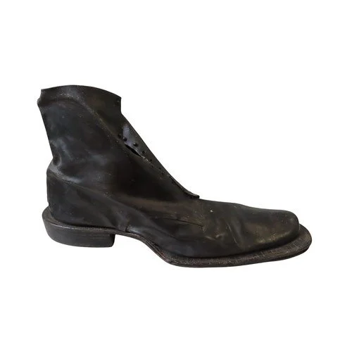 A LARGE COBBLERS SHOP DISPLAY LEATHER BOOT with layered heel and sole.