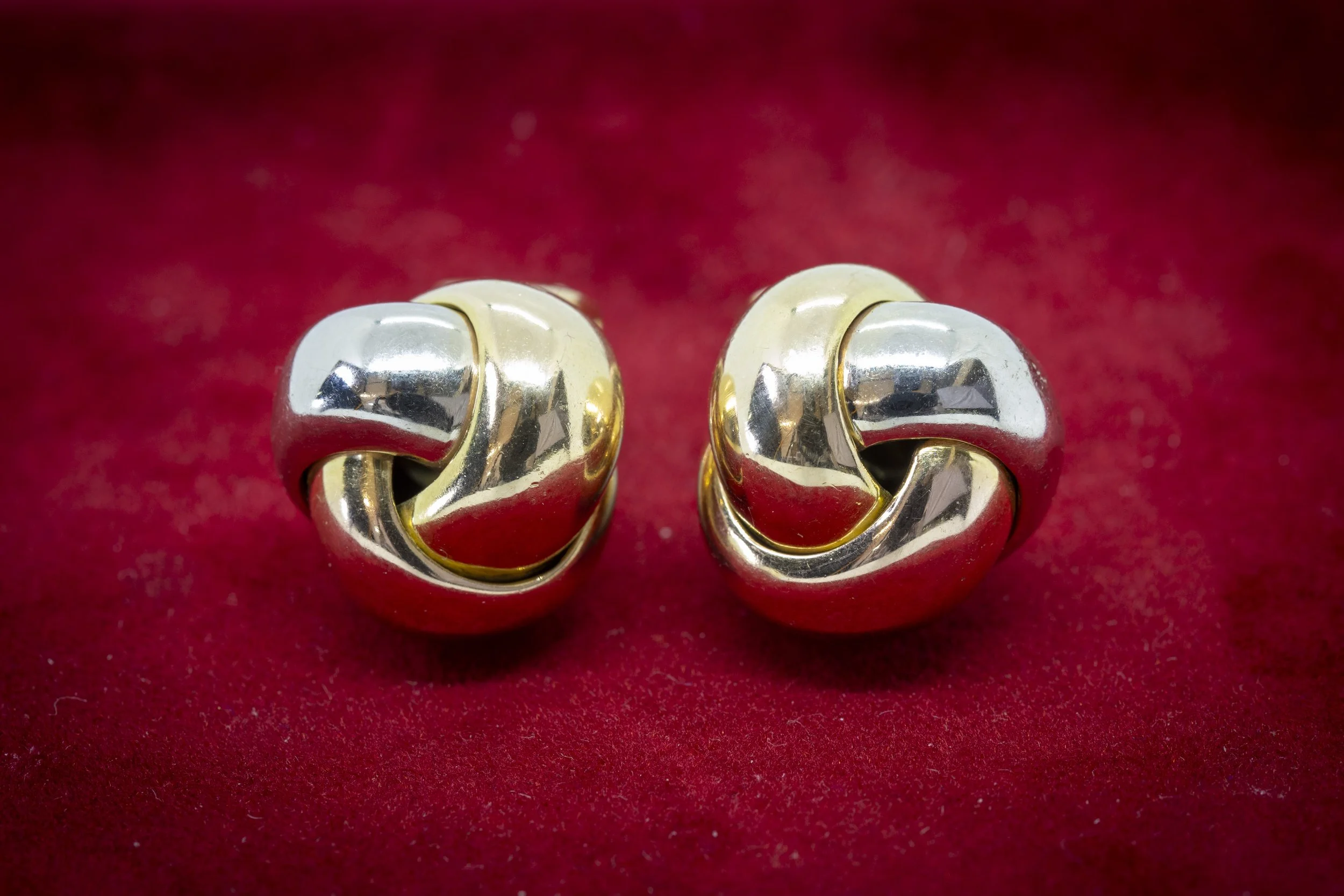 A PAIR OF 18 CARAT GOLD TRINITY KNOT EARRINGS BY CARTIER