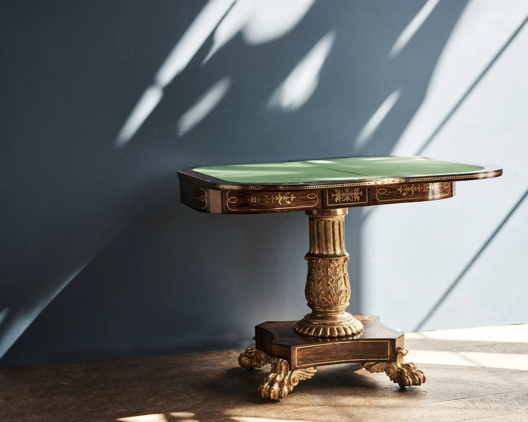Rosewood and brass inlay table