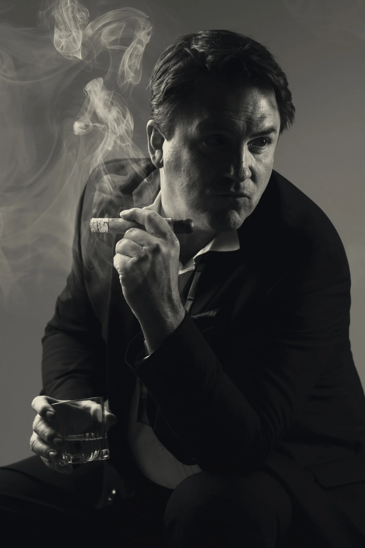 Black and white portrait of a man with a cigarette