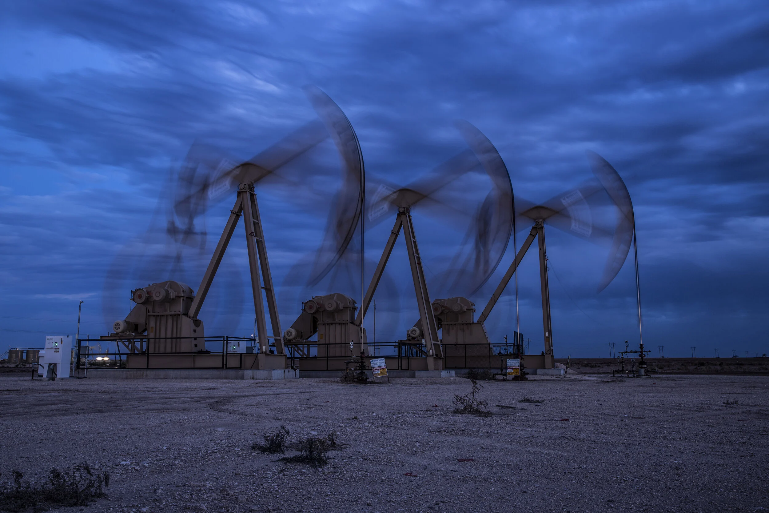 Pumpjacks silhouetted at dusk