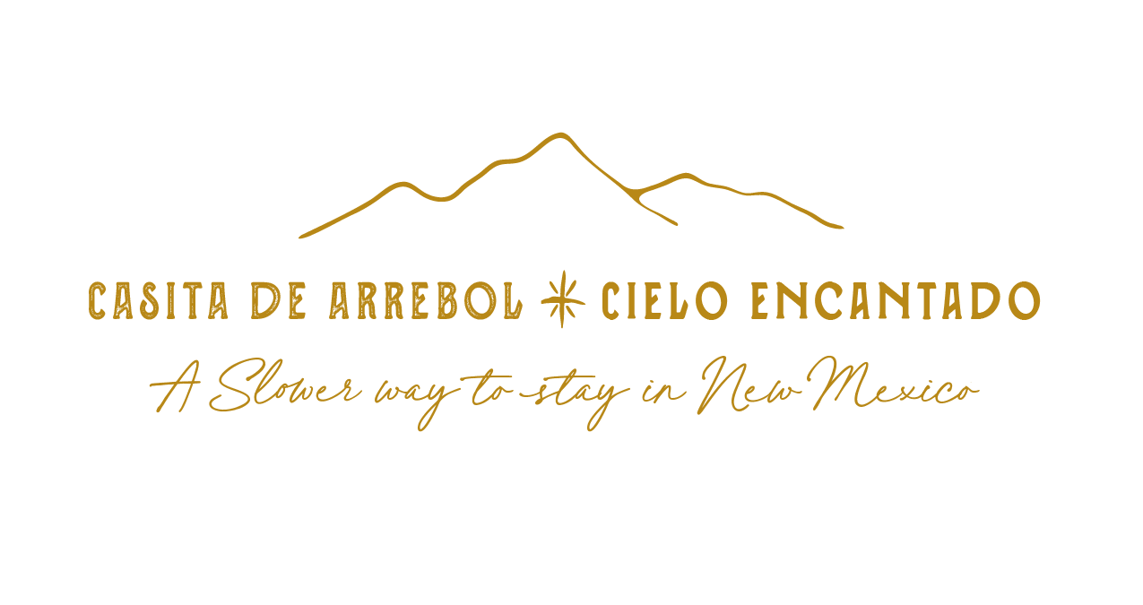 Casita de Arrebol and Cielo Encantado logo with mountain outline and the tagline “A slower way to stay in New Mexico.”