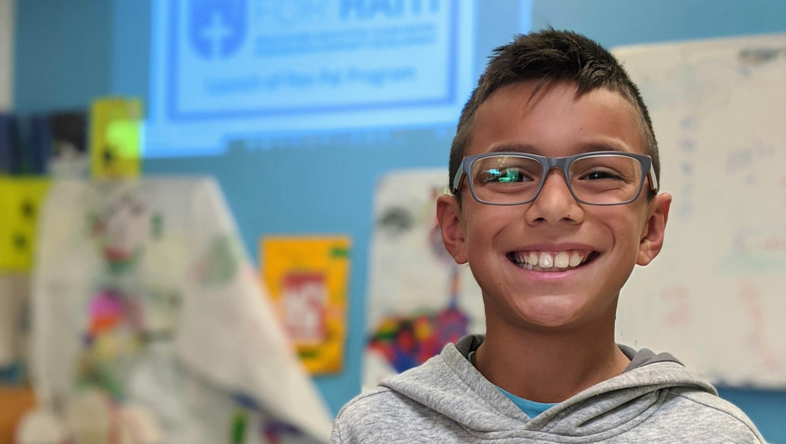 Smiling boy wearing glasses