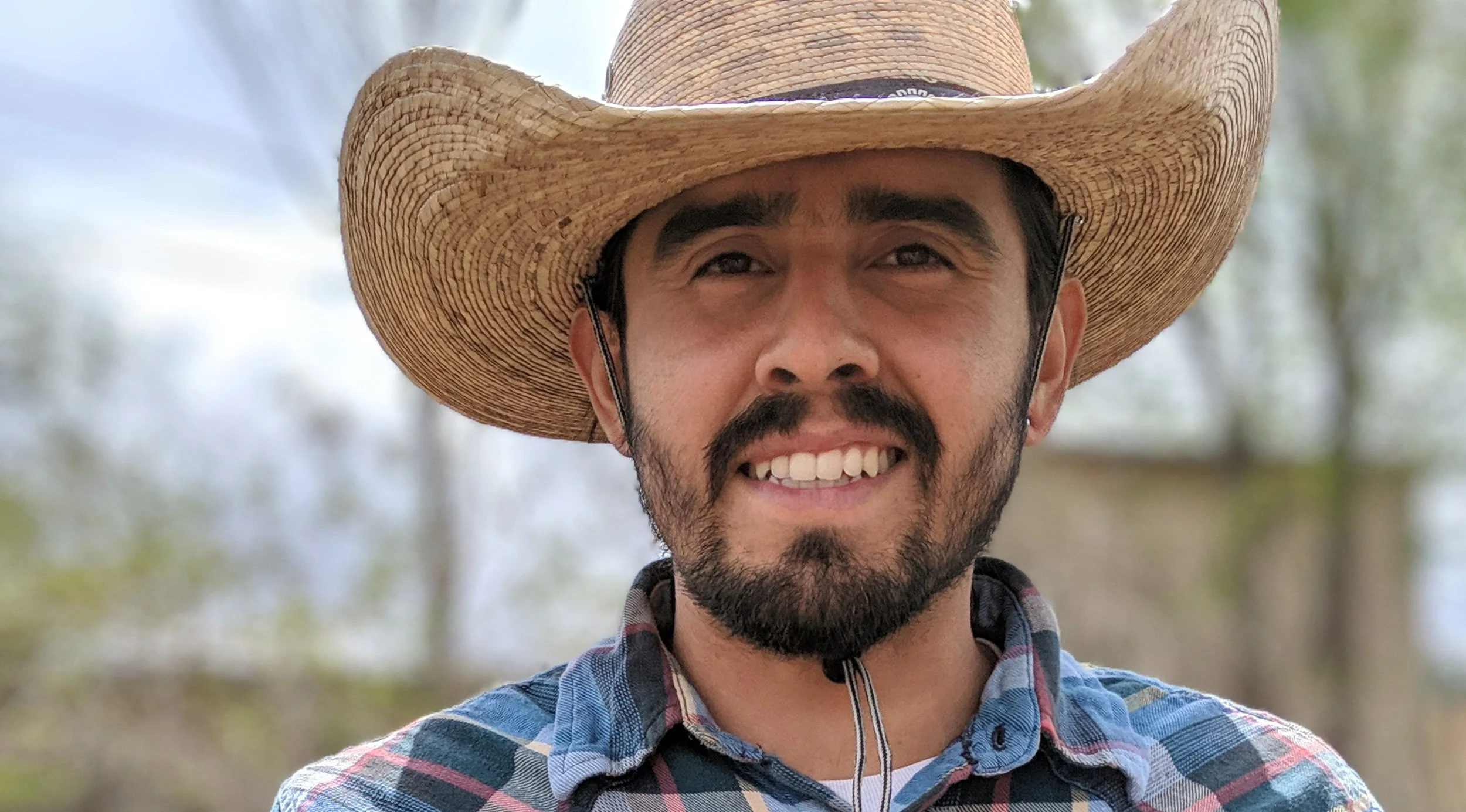 Smiling-young-Latino-male-with-short-beard-wearing-traditional-farmers-hat.jpg