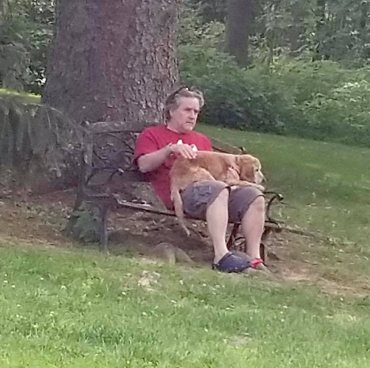 Albert snuggles with his foster dad. 