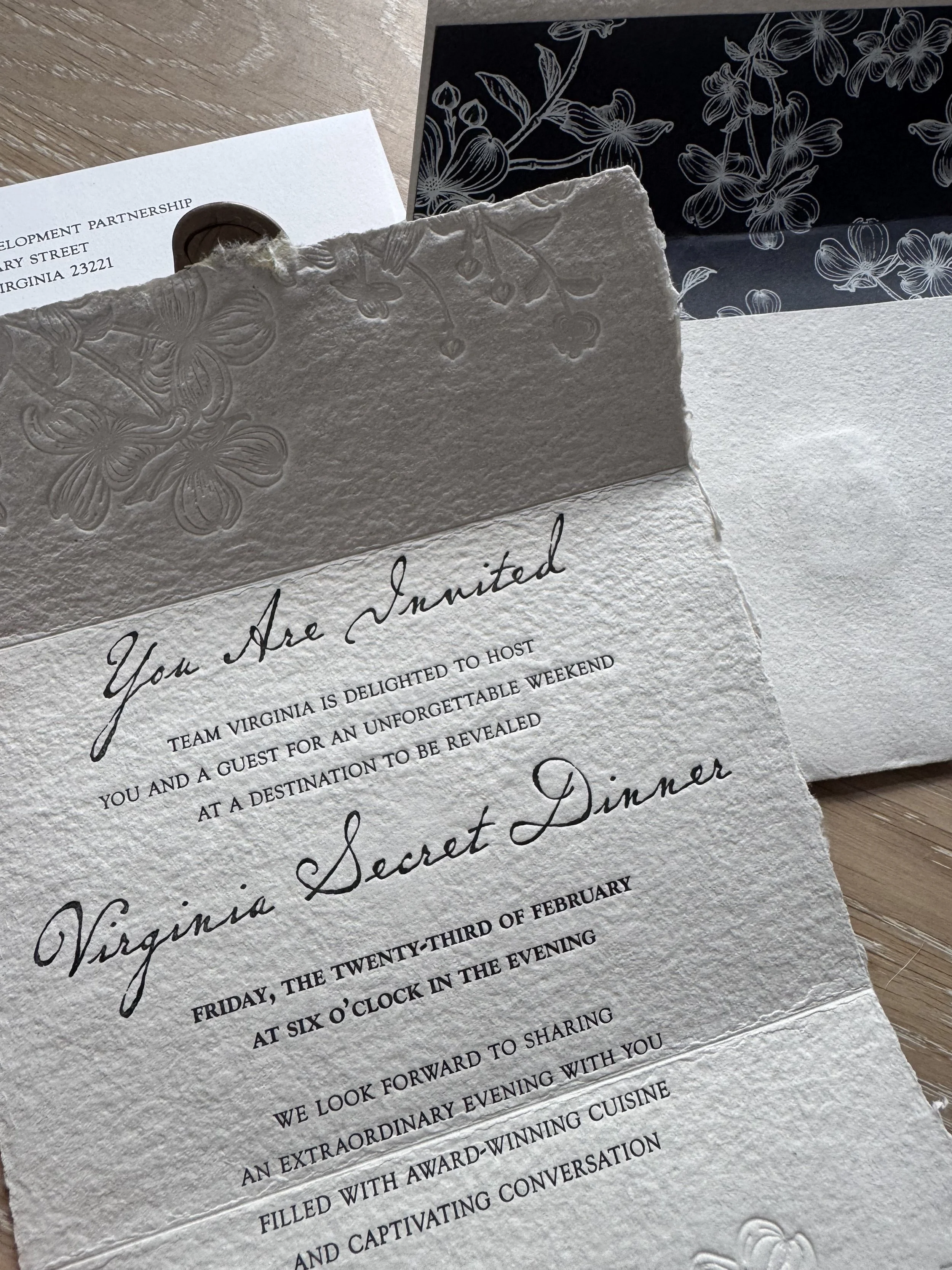 Formal invitation; certain elements carried through all Secret Dinners to create unique branding for these events. The dogwood illustration and wax seal are examples of these branded elements.