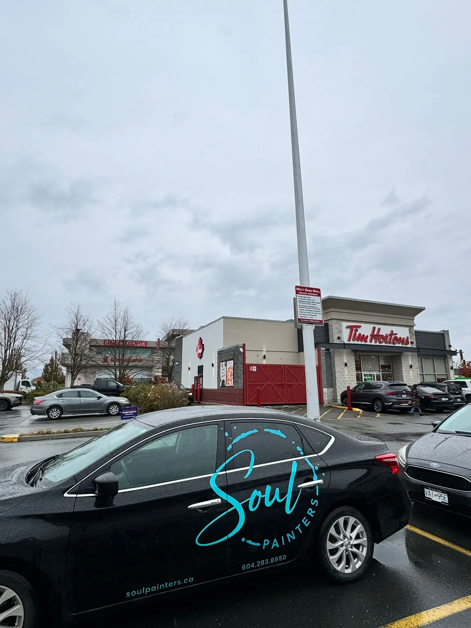 Soul Painters branded vehicle parked at a commercial plaza, promoting professional painting services and free painting estimate by local painters near you.