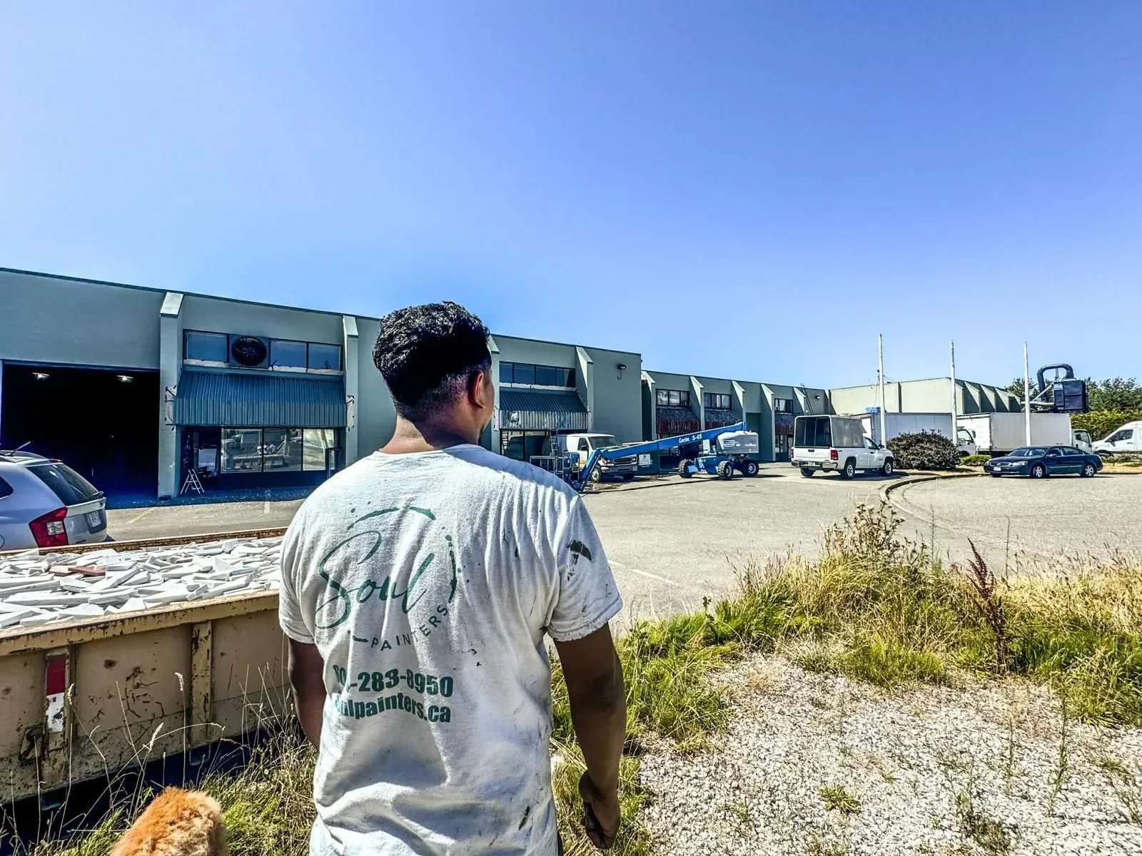 Soul Painters team member wearing branded uniform at a commercial property, representing professional painters offering free painting estimate and painting services near you.