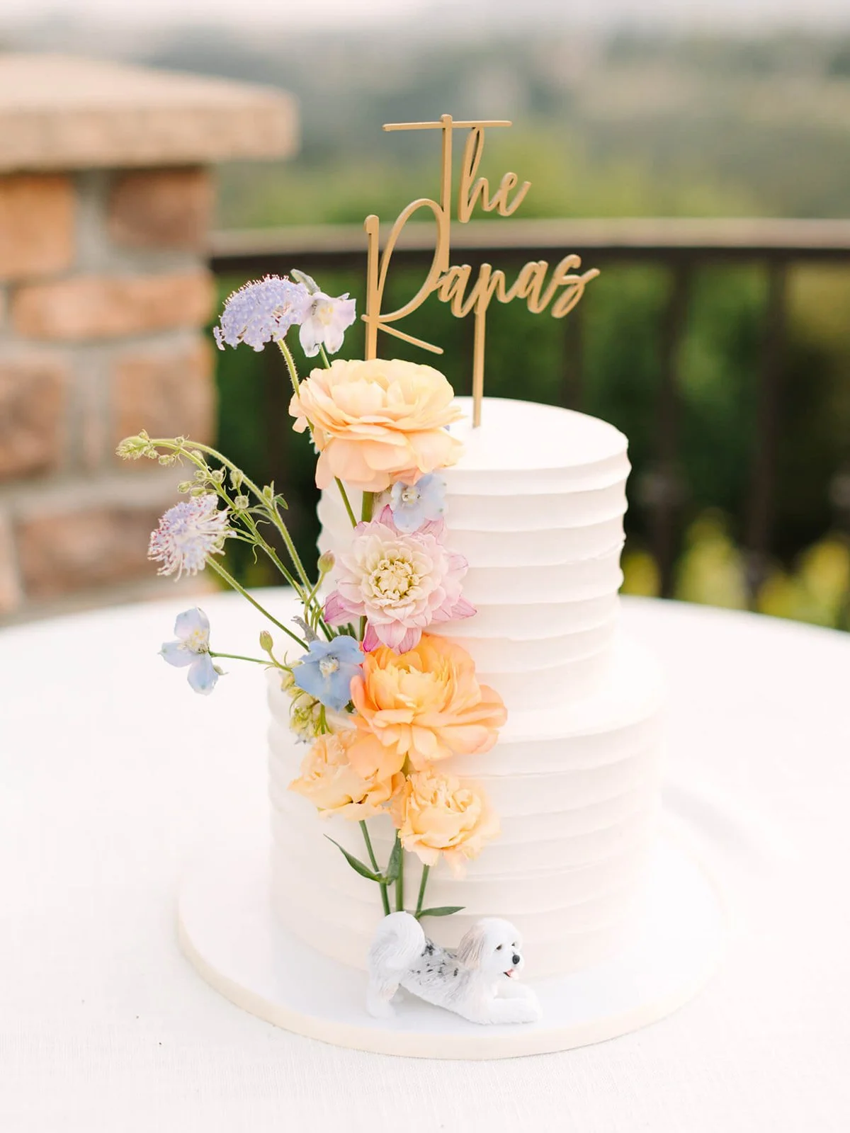 Two tier, buttercream cake with fresh florals by CItrus Blossom Bakery of Redlands, CA