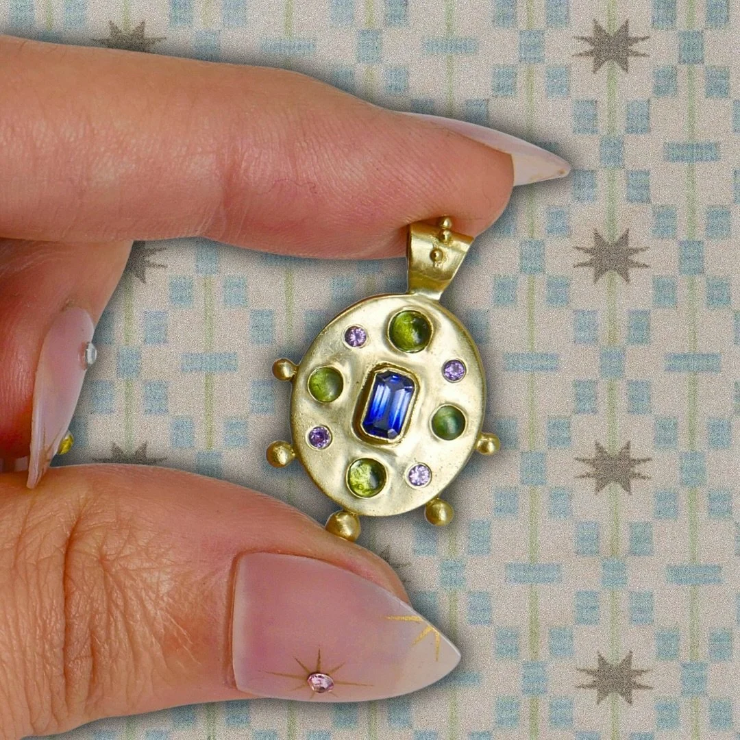 For all the big gold medallion peeps on your holiday shopping list! A magical bi-color blue sapphire center with juicy teal tourmaline cabochons and purple sapphire accents stones. I love this piece so much I know it will be hard to part with! Availa