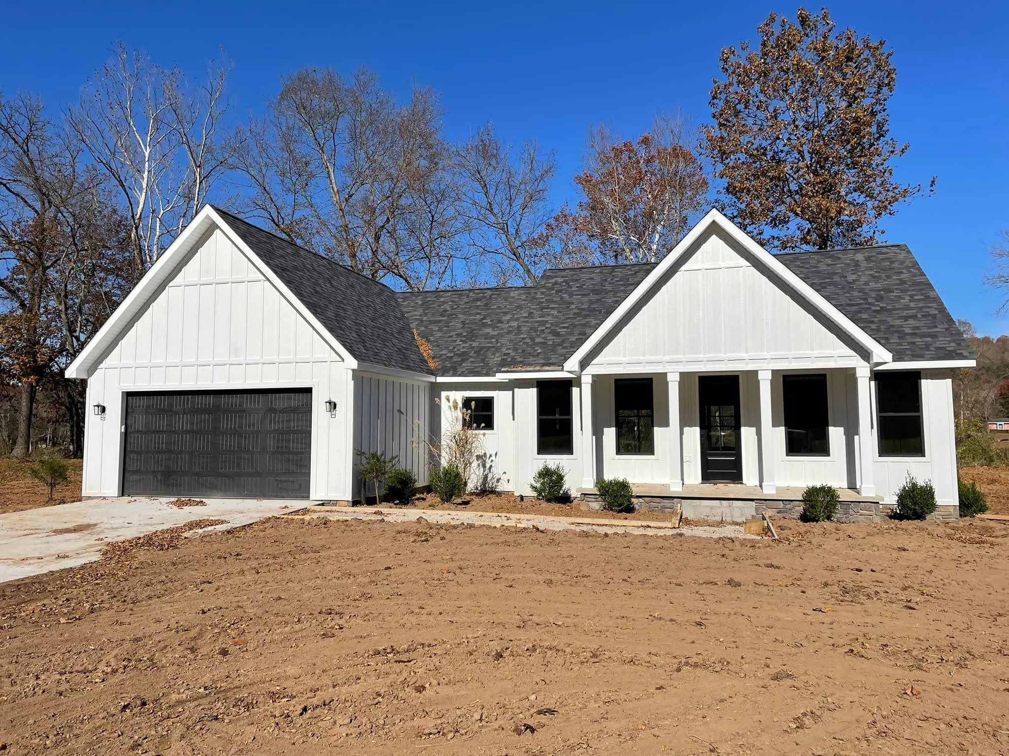 Close-up of sandy shoreline underwater with rippling water and small rocks.