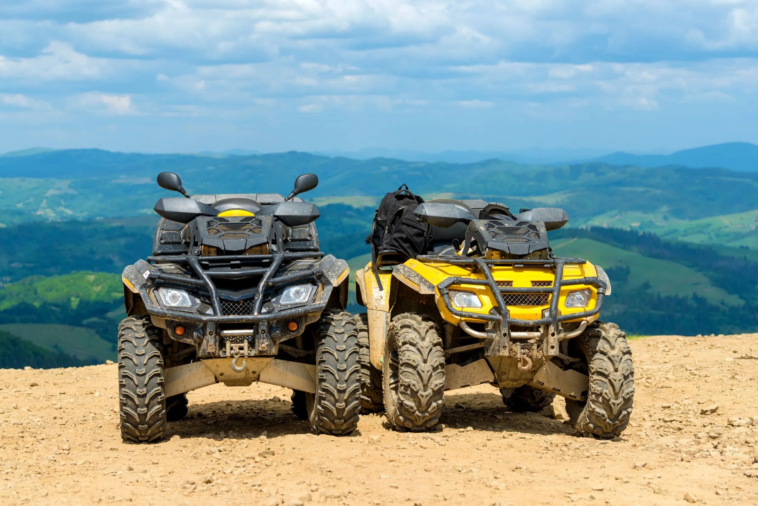 atv-quad-bike-in-front-of-mountains-landscape-3CDVTNX.jpg
