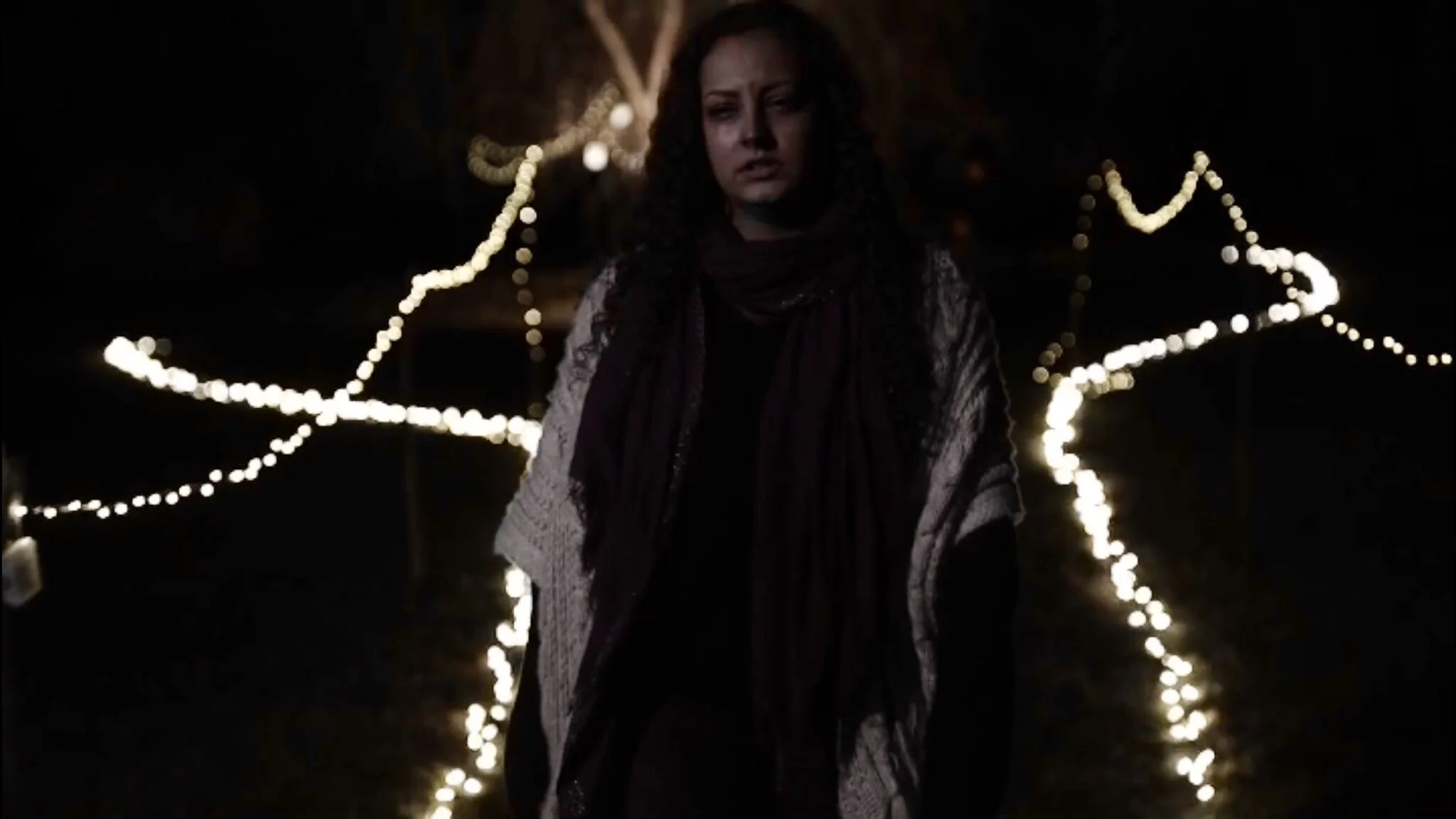 Still of Cheyenne in the music video for "Cheers" by Friends in Further Places