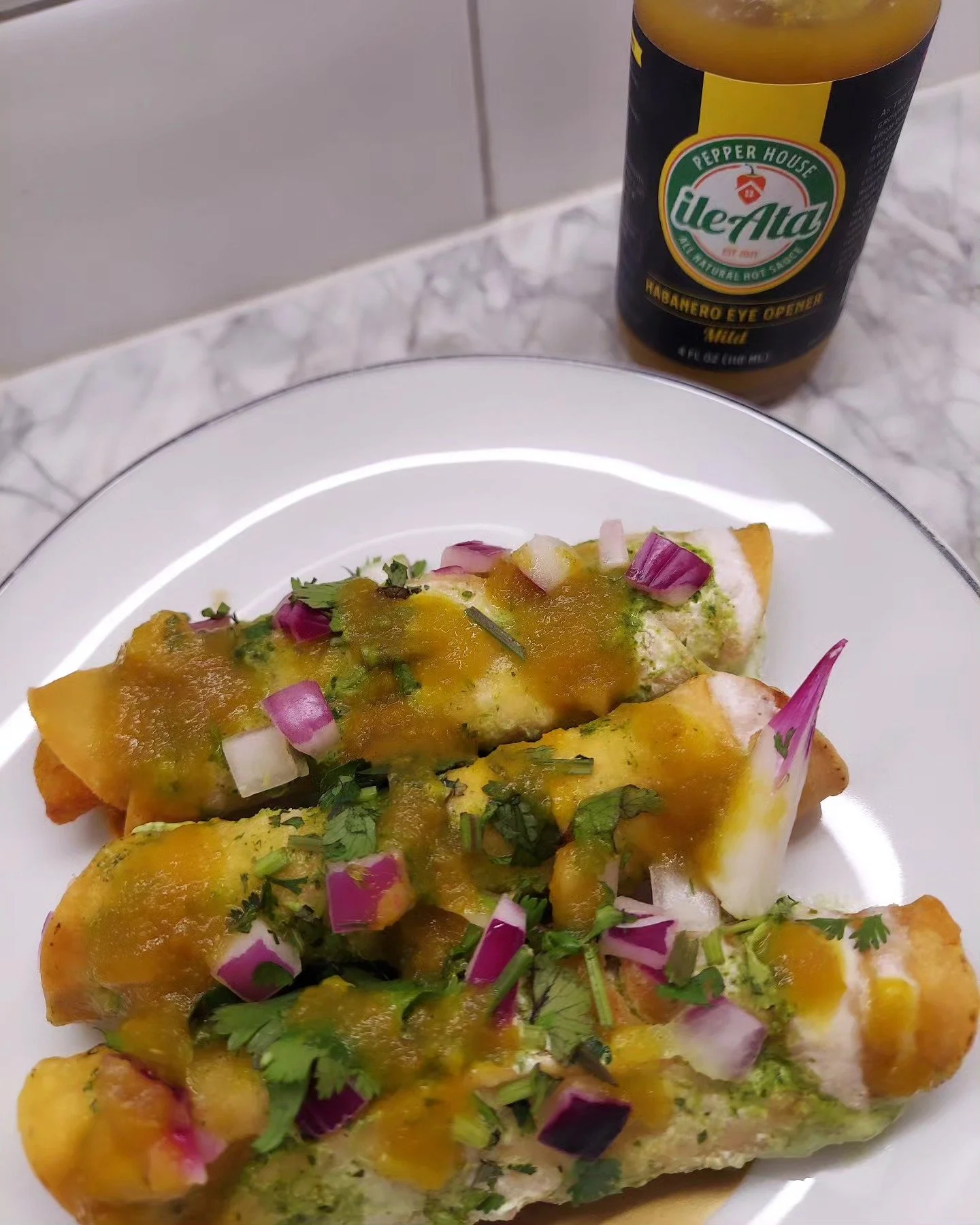 A healthy dash of yellow hot sauce spices up your tostadas 🔥 Try our Habanero Eye Opener Mild yellow sauce #HotSauce #HotSauceForSale #IleAtaHotSauce #IleAtaPepperHouse #IleAta #Tostadas #YellowSauce #YellowHotSauce #MildSauce #MildHotSauce